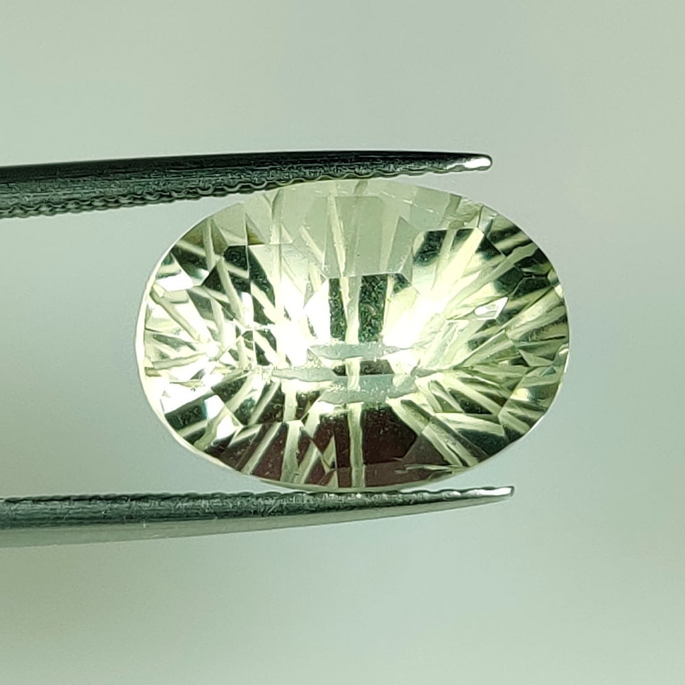 6.48 Ct Natural Green Amethyst Oval Football Cut: Weight - 6.48 Ct / Dimensions - 14.10 x 10.10 x 8.60 mm / Shape - Oval Cut / Color - Green / Clarity - VVS / Origin -Brazil / Treatment - Heated