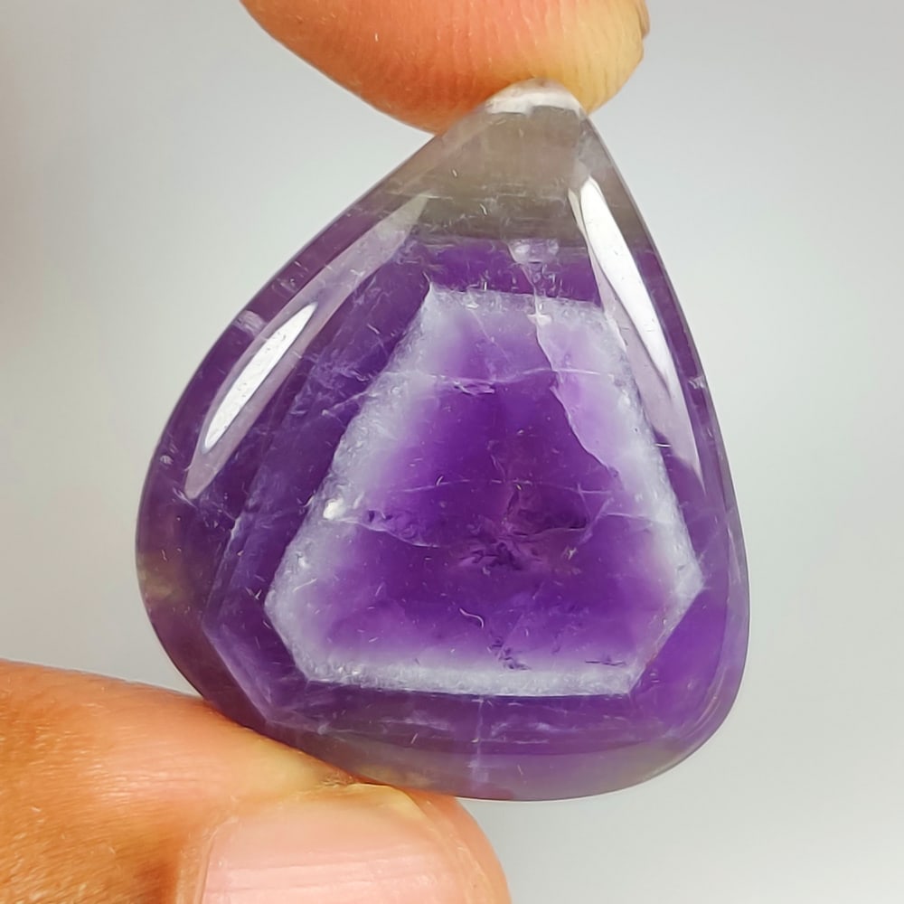 22.77 Ct Natural Chevron Amethyst Pear Cab: Weight - 22.77 Ct / Size - 25.40 x 22.10 x 5.10 mm / Shape - Pear Cab / Color - Purple / Clarity - Opaque / Origin -Brazil / Treatment - None