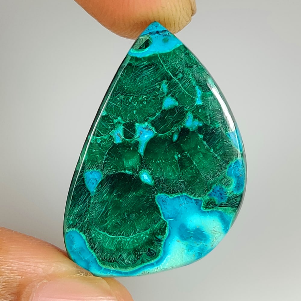 28.00 Ct Natural Azurmalachite Fancy Cab: Weight - 28.00 Ct / Size - 29.00 x 17.90 x 4.90 mm / Shape - Fancy Cab / Color - Green / Clarity - Opaque / Origin - Russia / Treatment - None