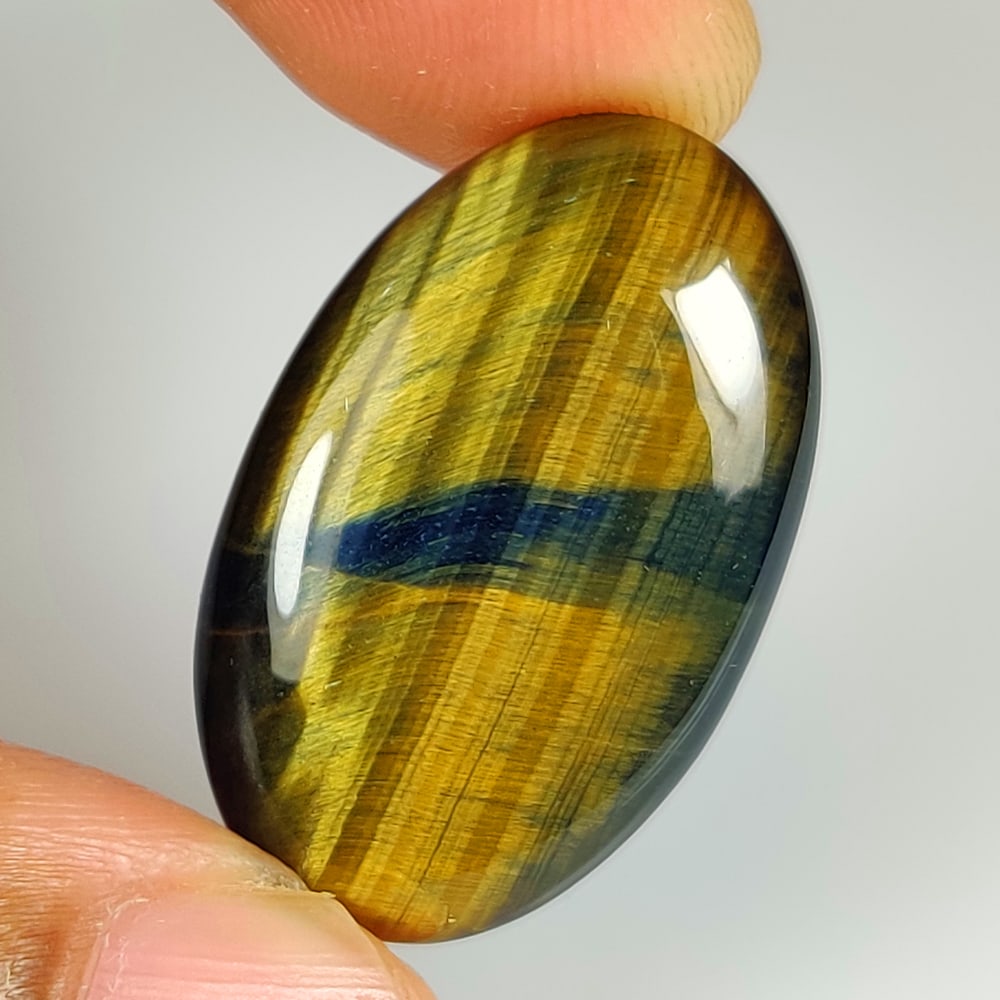 20.78 Ct Natural Black Tiger Eye Oval Cab: Weight - 20.78 Ct / Dimensions - 28.00 x 17.40 x 5.10 mm / Top Class Quality / Oval cab / Origin - Burmese / Comments - None