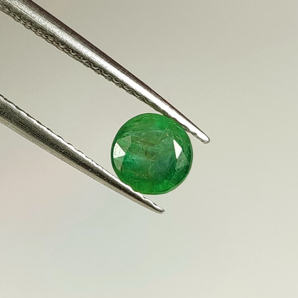 0.67 Ct Natural Zambian Green Emerald Round Cut (1 of 2)