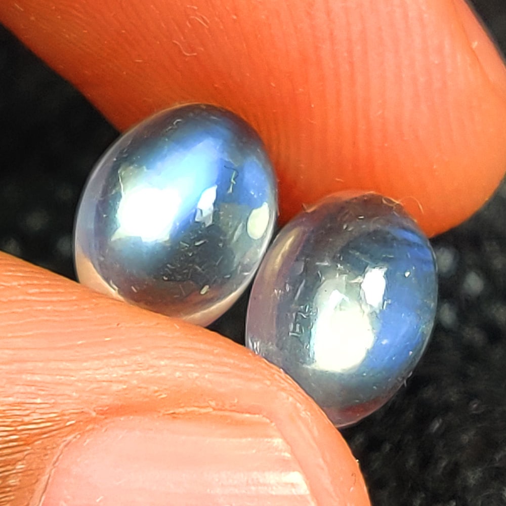 4.38 Ct Natural Blue Tint Moonstone Oval Cab Pair: Weight - 4.38 Ct / Size - 9.10 x 6.80 x 4.90 mm / 2 Pc's / Shape - Oval Cab / Clarity - Semi-Transparent / Origin - India / Treatment - None