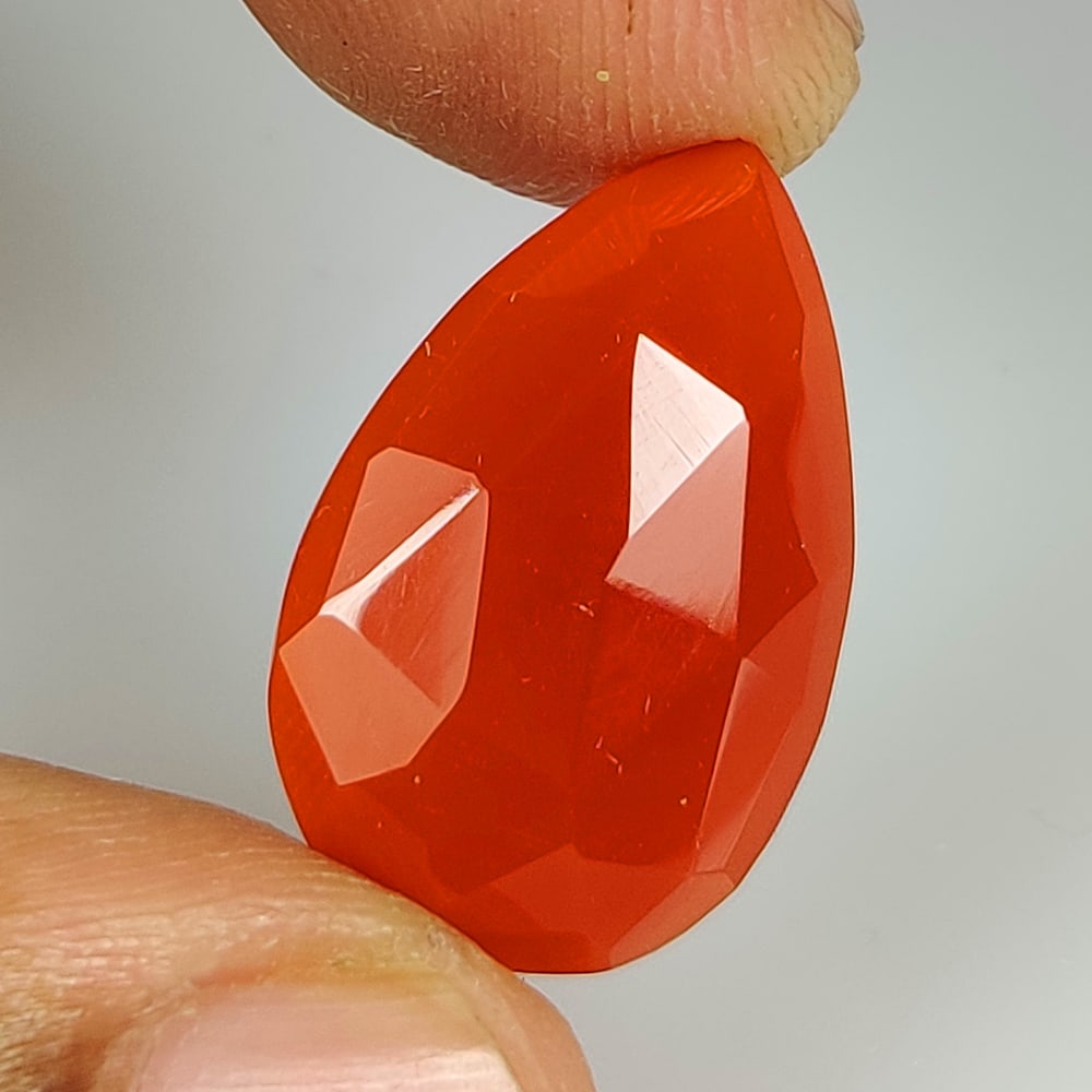 8.43 Ct Natural Orange Onyx Pear Cut: Weight - 8.43 Ct / Dimensions - 23.00 x 14.00 x 4.30 mm / Shape - Pear Cut / Clarity - Semi Transparent / Origin - Brazil / Treatment - None