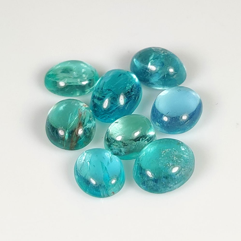 7.78 Ct Natural Blue Apatite Oval Cab Set: Weight - 7.78 Ct / Dimensions - 6.0x5.0 - 7.5x5.3 mm / 8 Pc's / Top Class Quality / Oval Cab / Origin - Brazil / Treatment - None