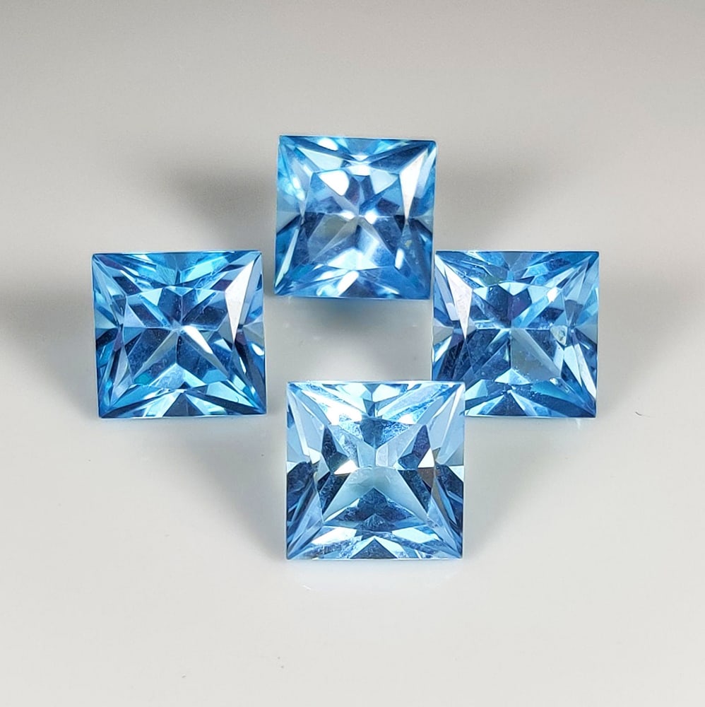 19.88 Ct Natural Blue Topaz Square Cut Set: Weight - 19.88 Ct / Dimensions - 9.00 - 9.20 mm / 4 Pc's / Shape & Cut - Square Cut / Color - Blue / Transparency - VVS / Origin - Brazil / Comments - Irradiated
