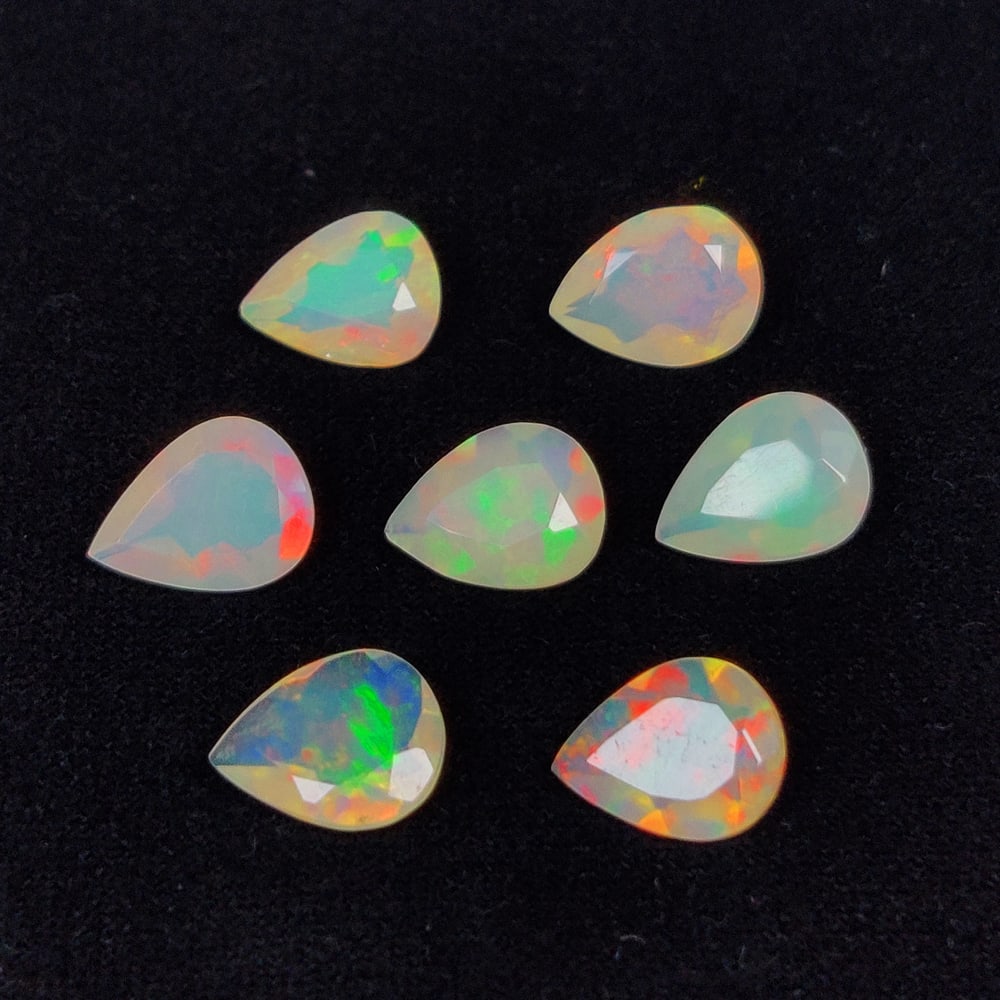 4.38 Ct Natural Multicolor Welo Opal Top Fire Peat Cut Set: Weight - 4.38 Ct / Size - 8.0x6.0 - 8.2x6.1 mm / 7 Pc's / Shape - Pear Cut / Color - Multicolor / Clarity - Translucent / Origin - Ethiopia / Treatment - None