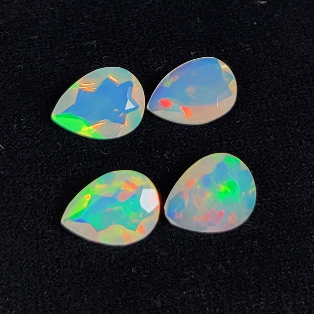 2.14 Ct Natural Multi-Color Welo Opal Flash Fire Pear Cut Set: Weight - 2.14 Ct / Size - 8.0x6.0 - 8.1x6.1 mm / 4 Pc's / Shape - Pear Cut / Color - Multicolor / Clarity - Translucent / Origin - Ethiopia / Treatment - None