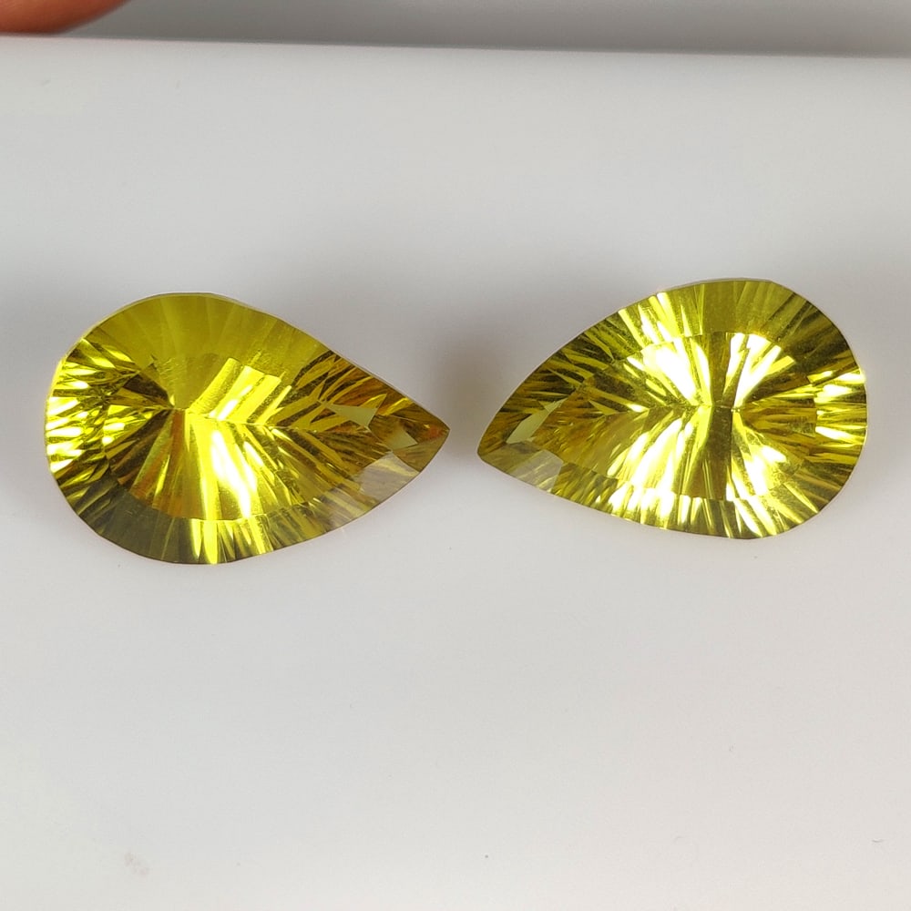 17.77 Ct Natural Lemon Quartz Pear Cut Pair: Weight - 17.77 Ct / Size - 18.20 x 12.10 x 8.30 mm / 2 Pc's / Shape - Pear Cut / Clarity - VVS / Origin - Brazil / Treatment - Heated