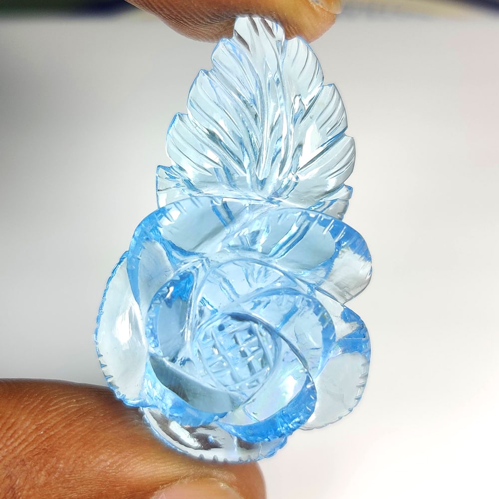 52.42 Ct Natural Blue Topaz Fancy Flower Carving: Weight - 52.42 Ct / Dimensions - 39.00 x 25.00 x 20.00 mm / Shape - Fancy Flower Carving / Color - Blue / Clarity - VVS / Origin - Brazil / Treatment - Irradiated