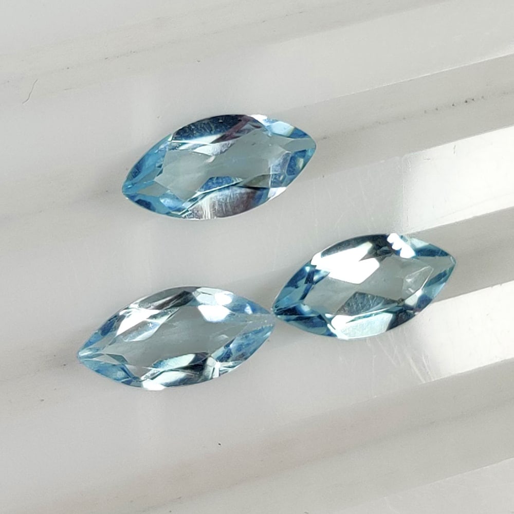 3.50 Ct Natural Blue Topaz Marquise Cut Set: Weight - 3.50 Ct / Size - 10.0x5.0 - 10.1x5.1 mm / 3 Pc's / Shape - Marquise Cut / Color - Blue / Clarity - VVS / Origin - Brazil / Treatment - Irradiated