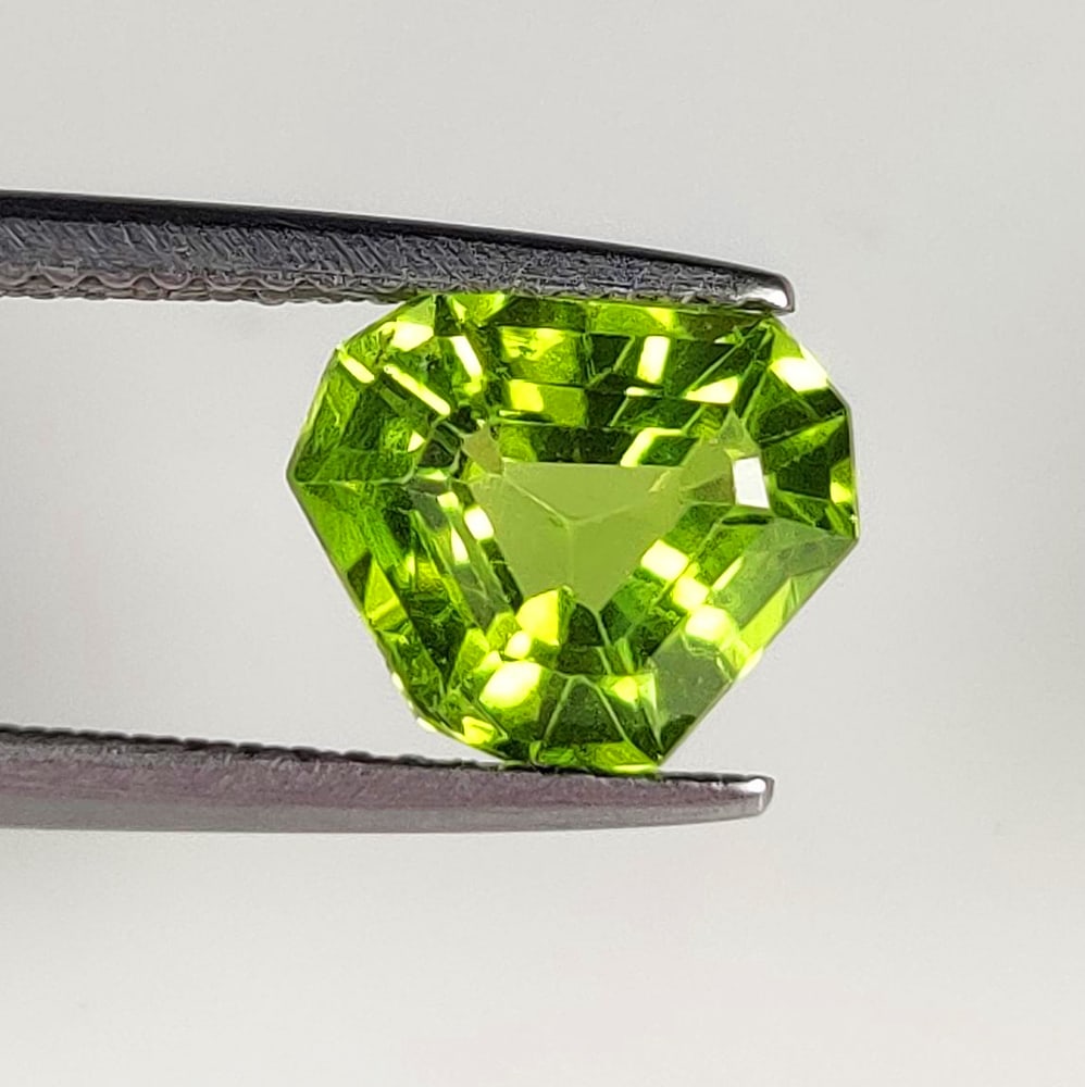2.46 Ct Natural Green Peridot Rare Trillion Cut: Weight - 2.46 Ct / Dimensions - 9.60 x 8.00 x 5.50 mm / Shape - Trillion Cut / Color - Green / Clarity - VVS / Origin - Pakistan / Treatment - None