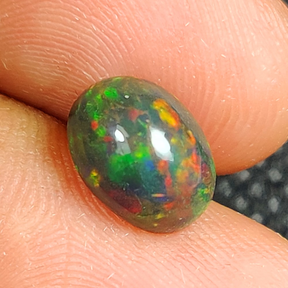 1.67 Ct Natural Black Flashing Fire Opal OVal Cab (1 of 3)