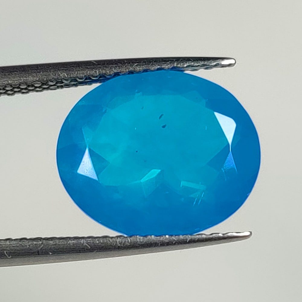 2.93 Ct Natural Blue Fire Opal Oval cut: Weight - 2.93 Ct / Size -11.90 x 10.00 x 7.00 mm / Shape - Oval cut / Transparency - Transparent / Origin - Ethiopia / Treatment - Heated