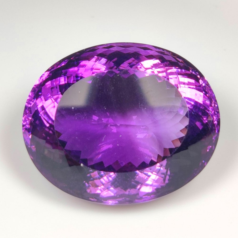 137.56 Ct Natural Purple Amethyst Oval Cut: Weight - 137.56 Ct / Dimensions - 38.00 x 31.00 x 28.00 mm / Shape - Oval Cut / Color - Purple / Clarity - VVS / Origin -Brazil / Treatment - Heated