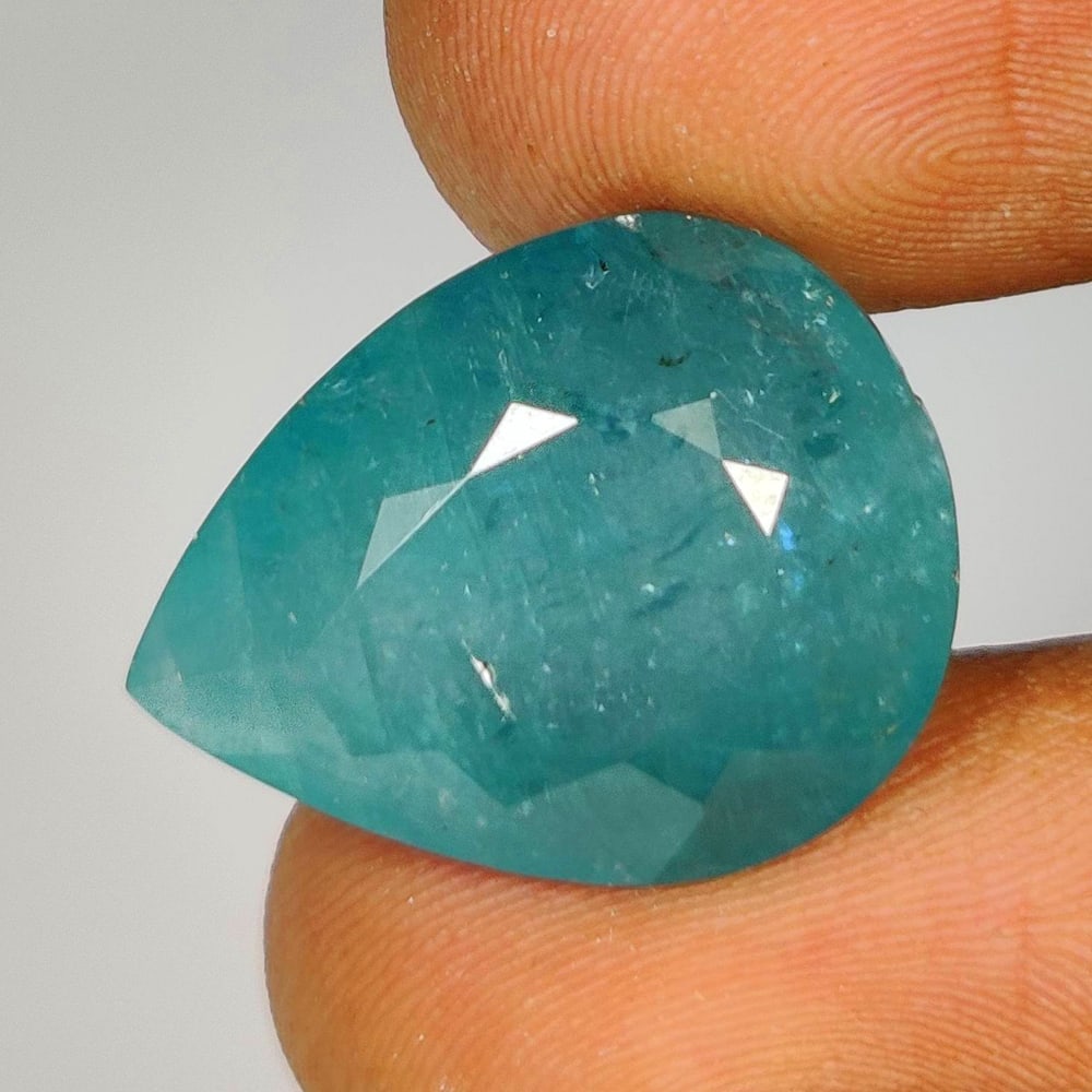 14.43 Ct Natural Grandidierite Pear Cut: Weight - 14.43 Ct / Dimensions - 18.80 x 14.70 x 9.70 mm / Shape - Pear Cut / Clarity - Opaque / Origin - Madagascar / Treatment - None