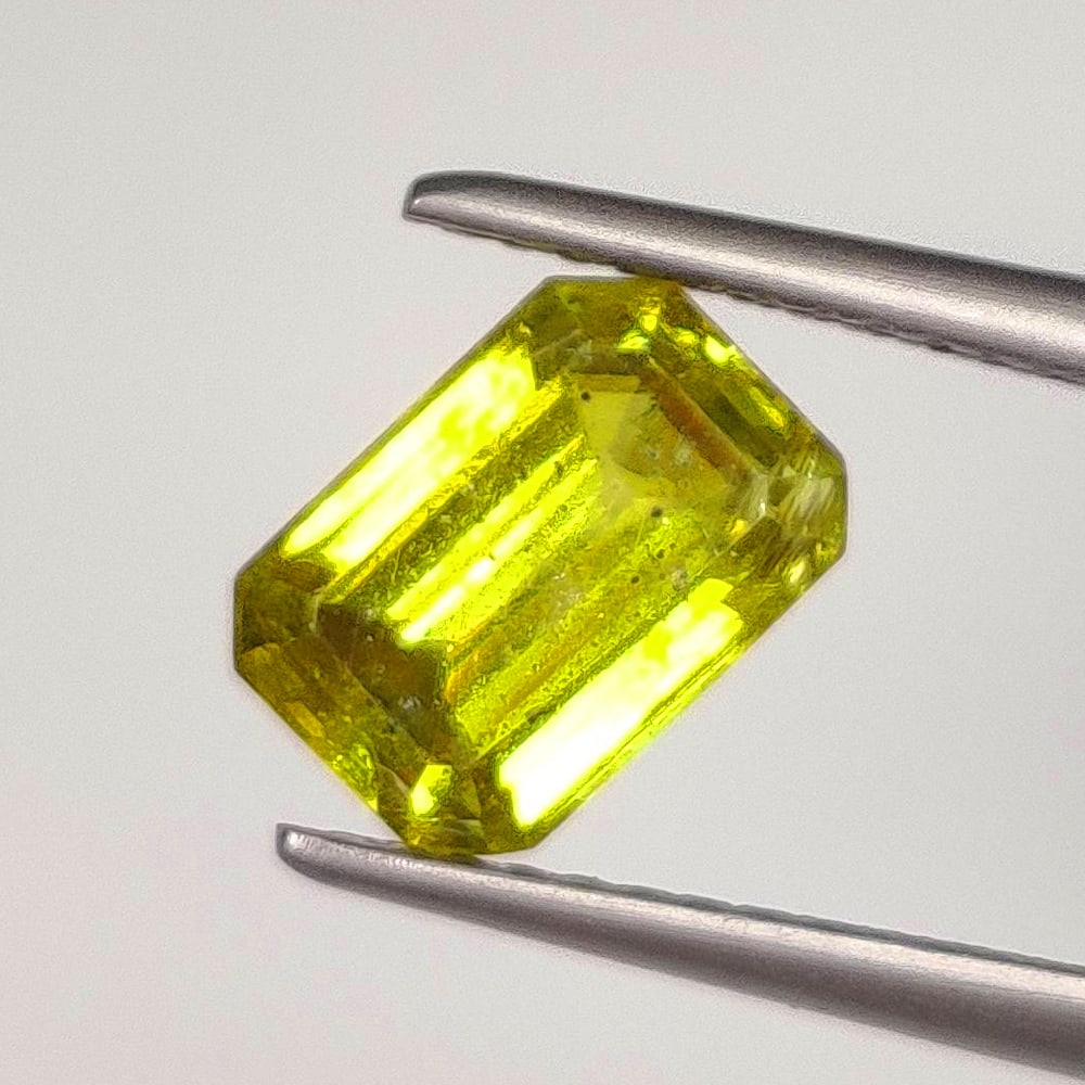 2.02 Ct Natural Green Sphene Emerald Cut: Weight : 2.02 Ct / Dimensions : 8.40 x 5.80 x 4.30 mm / Shape : Emerald Cut / Color : Yellowish Green / Transparency : Transparent / Treatment : No any treatment