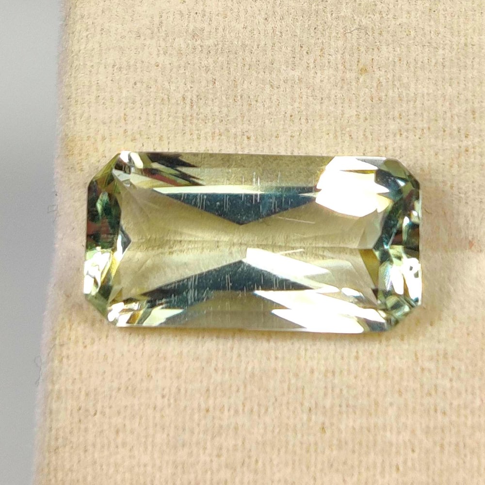 6.93 Ct Natural Green Amethyst Octagon Cut: Weight - 6.93 Ct / Size - 17.00 x 8.80 x 6.30 mm / Shape - Octagon Cut / Color - Green / Clarity - VVS / Origin - Brazil / Treatment - Heated