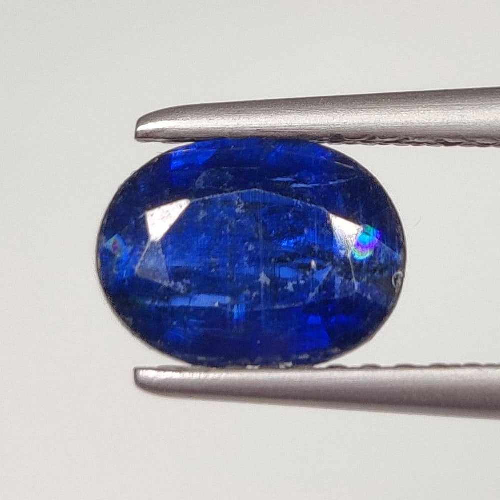 1.52 Ct Natural Blue Kyanite Oval Cut: Weight - 1.52 Ct / Size - 8.00 x 6.00 x 3.60 mm / Shape - Oval Cut / Color - Blue / Clarity - SI / Origin - India / Treatment - None