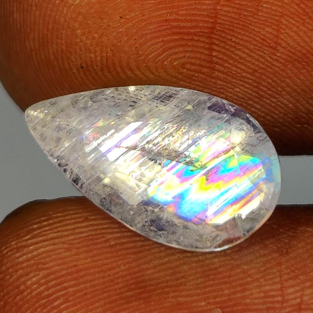 4.08 Ct Natural Rainbow Moonstone Pear Cut: Weight - 4.08 Ct / Size - 15.00 x 8.80 x 6.00 mm / Shape - Pear Cut / Clarity - Semi-Transparent / Origin - India / Treatment - None