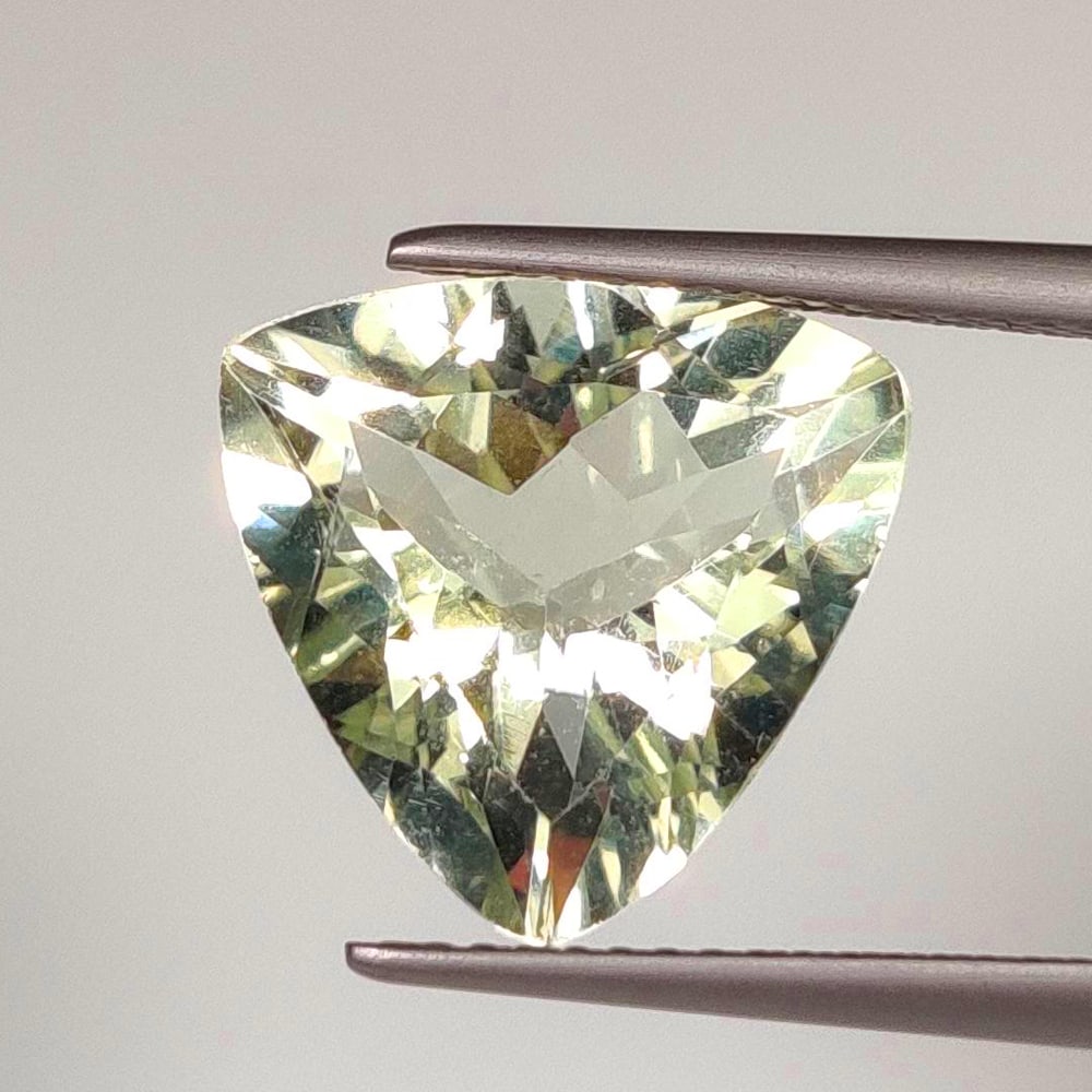 5.80 Ct Natural Green Amethyst Trillion Cut: Weight - 5.80 Ct / Size - 12.90 x 13.00 x 7.50 mm / Shape - Trillion Cut / Color - Green / Clarity - VVS / Origin - Brazil / Treatment - Heated