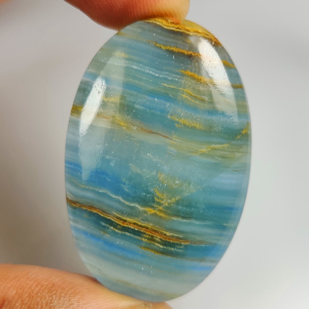 74.37 Ct Natural Aquamarine OVal Cab: Weight - 74.37 Ct / Size - 46.00 x 30.00 x 6.60 mm / Shape - OVal Cab / Color - Blue / Clarity - Opaque / Origin -India / Treatment - None