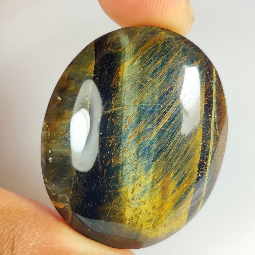 68.38 Ct Natural Tiger Eye Oval Cab (1 of 3)