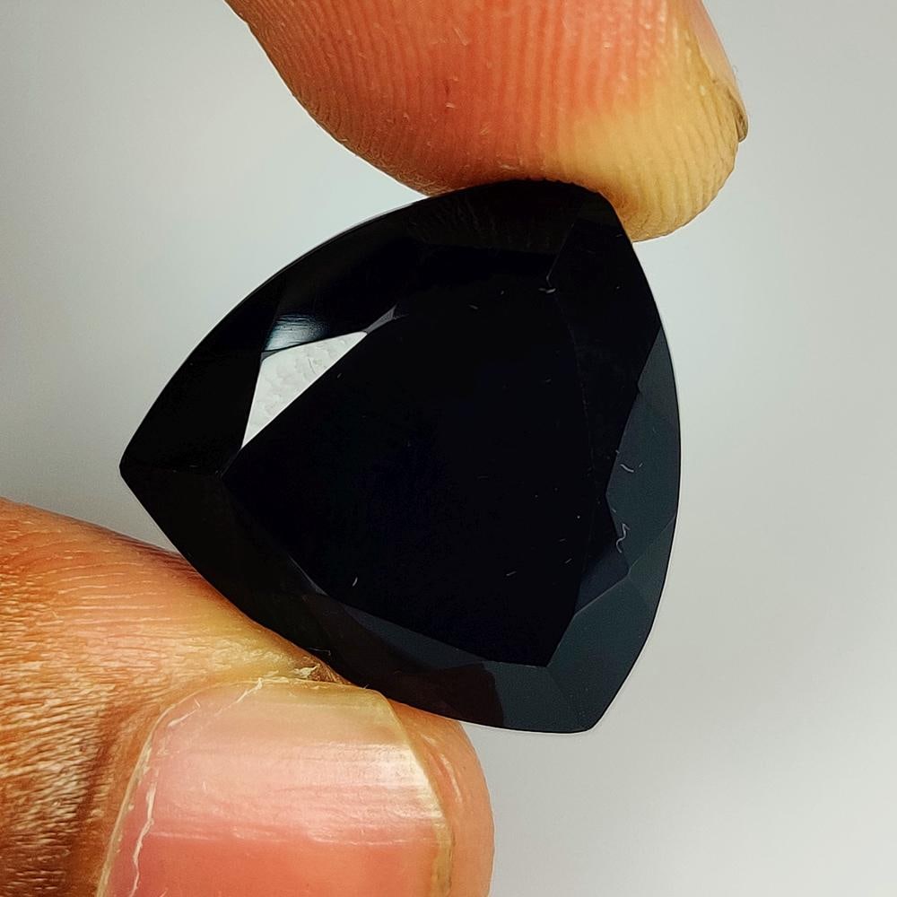 14.45 Ct Natural Black Onyx Trillion Cut: Weight - 14.45 Ct / Size - 19.00 x 18.60 x 7.50 mm / Shape - Trillion Cut / Clarity - Opaque / Origin - Brazil / Treatment - None