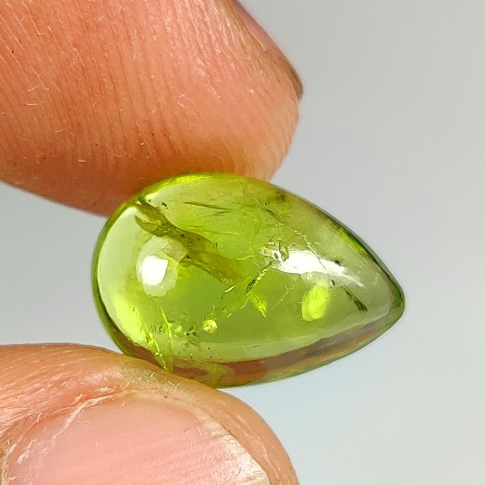 4.97 Ct Natural Green Peridot Pear Cab: Weight - 4.97 Ct / Dimensions - 13.50 x 9.30 x 4.70 mm / Shape & Cut - Pear Cab / Transparency - Transaprent / Origin - Pakistan / Comments - None