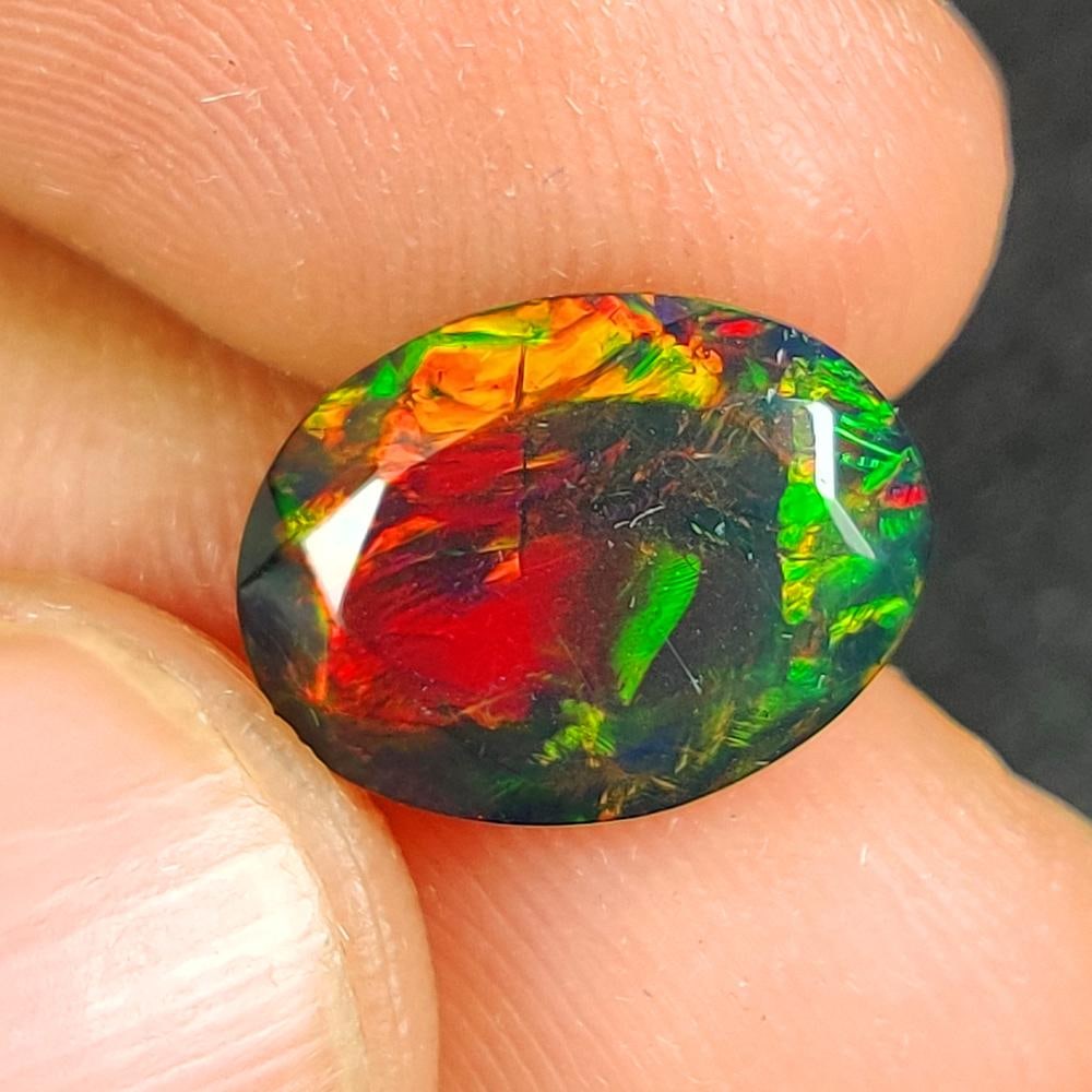3.08 Ct Natural Black Flashing Fire Opal OVal Cut (1 of 2)