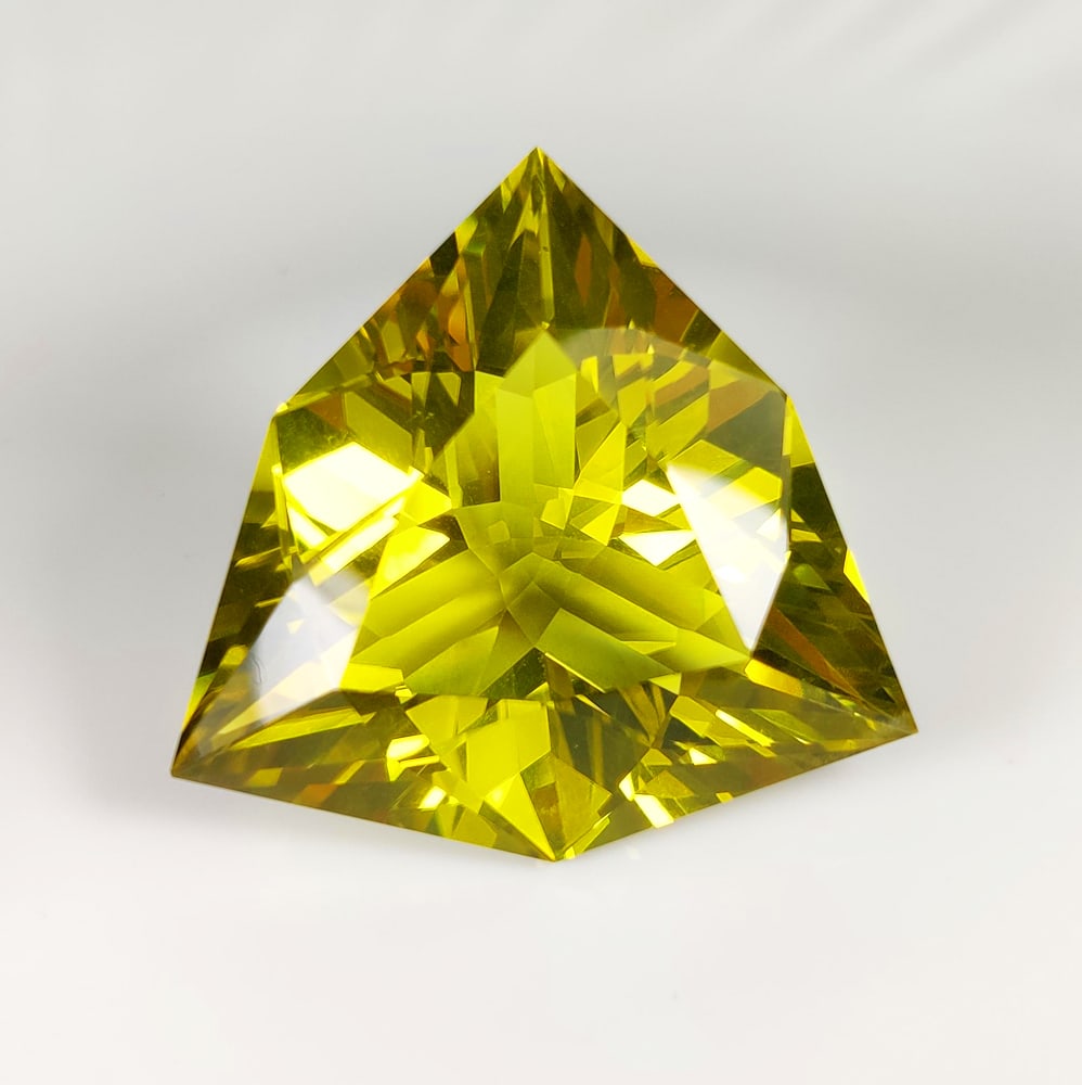 151.49 Ct Natural Lemon Quartz JUMBO Trillion Cut: Weight - 151.49 Ct / Dimensions - 42.00 x 42.00 x 24.00 mm / Top Quality Luster / Excellent Trillion Cut / Origin - Brazil / Comments - Heated