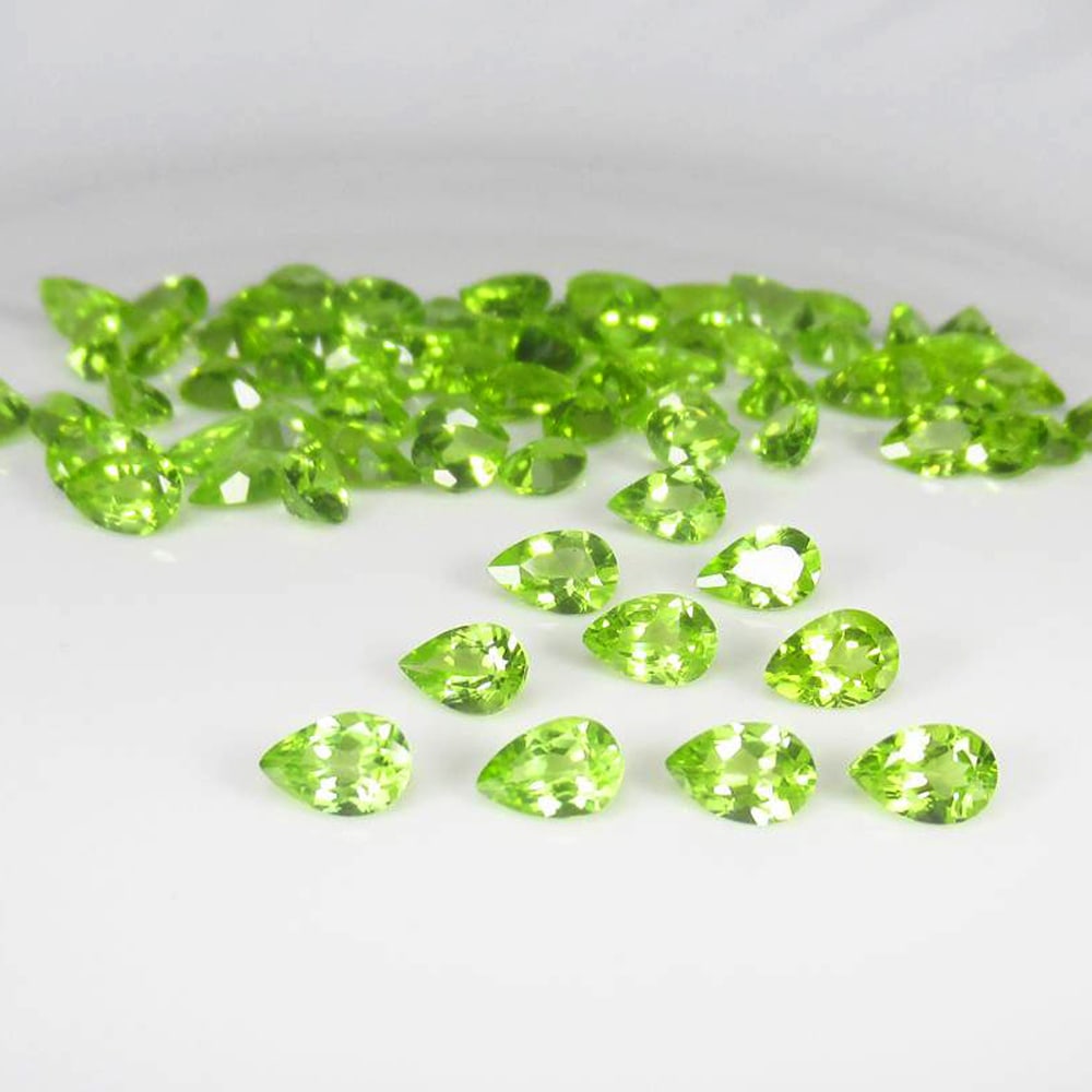 30.94 Ct Natural Green Peridot Top Luster Pear Calibrate Lot: Weight - 30.94 Ct / Dimensions - 6.00 x 4.00 mm / 75 Pc's / Shape - Pear Cut / Color - Green / Clarity - SI / Origin - Pakistan / Treatment - None