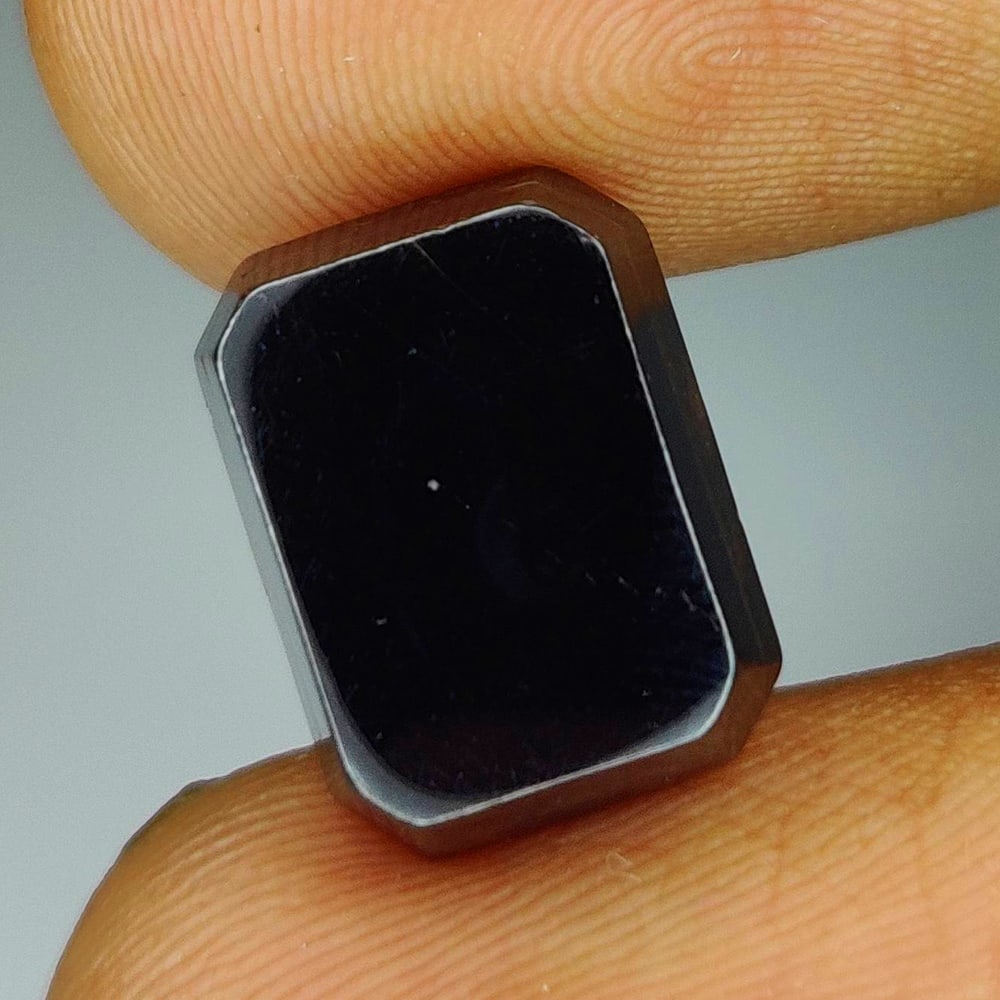 9.38 Ct Natural Gun Metal Quartz Octagon cab: Weight - 9.38 Ct / Dimensions - 12.00 x 9.00 x 4.50 mm / Shape & Cut - Octagon cab / Transparency -Opaque / Origin - Brazil