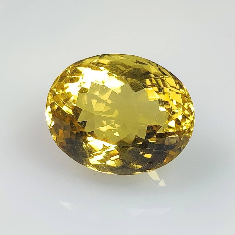 CERTIFIED 13.83 Ct Natural Lemon Quartz Oval Cut: Weight - 13.83 Ct / Dimensions - 16.30 x 13.30 x 10.60 mm / Top Quality Luster / Excellent Oval Cut / Origin - Brazil / Comments - Heated