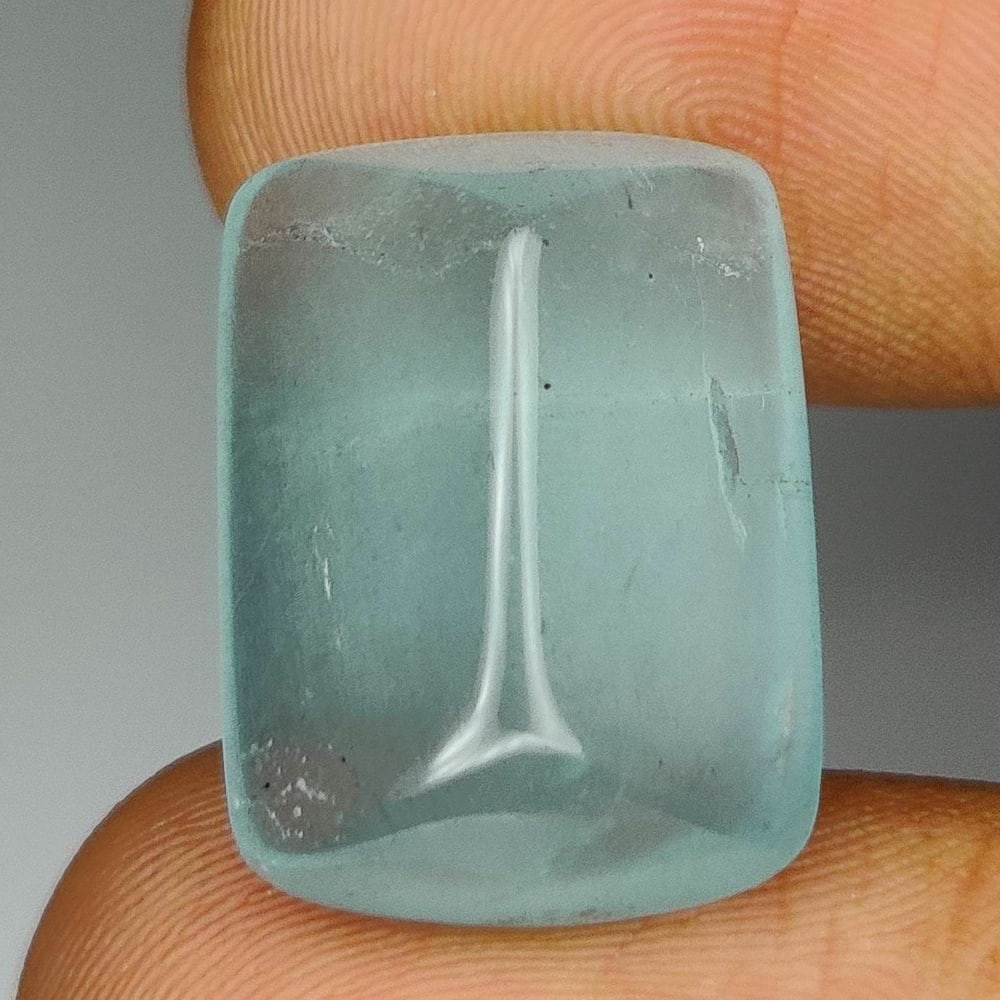 13.31 Ct Natural Aquamarine Cushion Cab: Weight - 13.31 Ct / Size - 17.70 x 13.10 x 7.60 mm / Shape - Cushion Cab / Color - Blue / Clarity - Opaque / Origin -India / Treatment - None