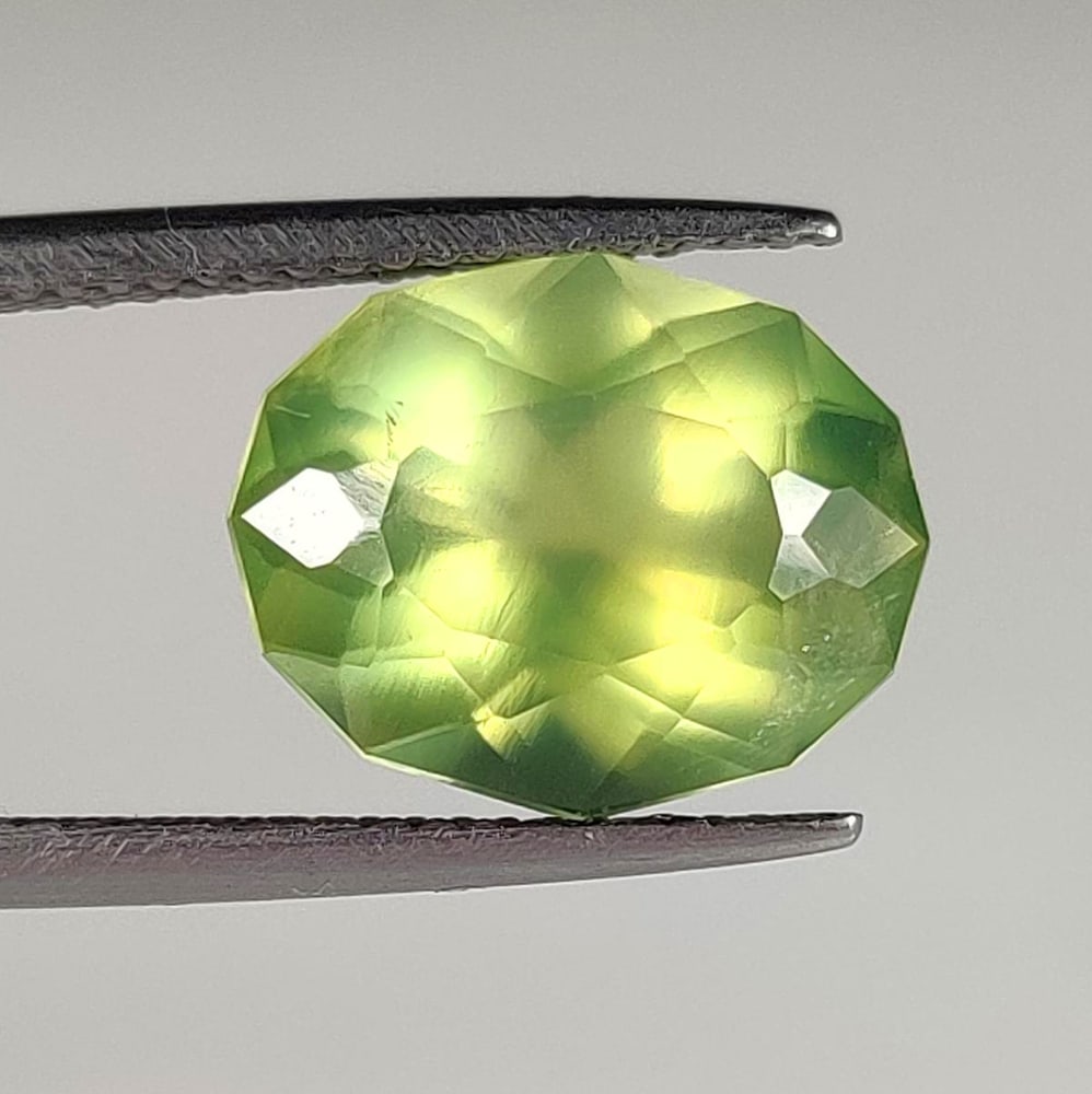 5.21 Ct Natural Green Prehnite Oval Fancy Cut: Weight - 5.21 Ct / Dimensions - 13.00 x 10.80 x 6.50 mm / Shape & Cut - Oval Cut / Transparency - Transaprent / Origin - Brazil / Comments - None