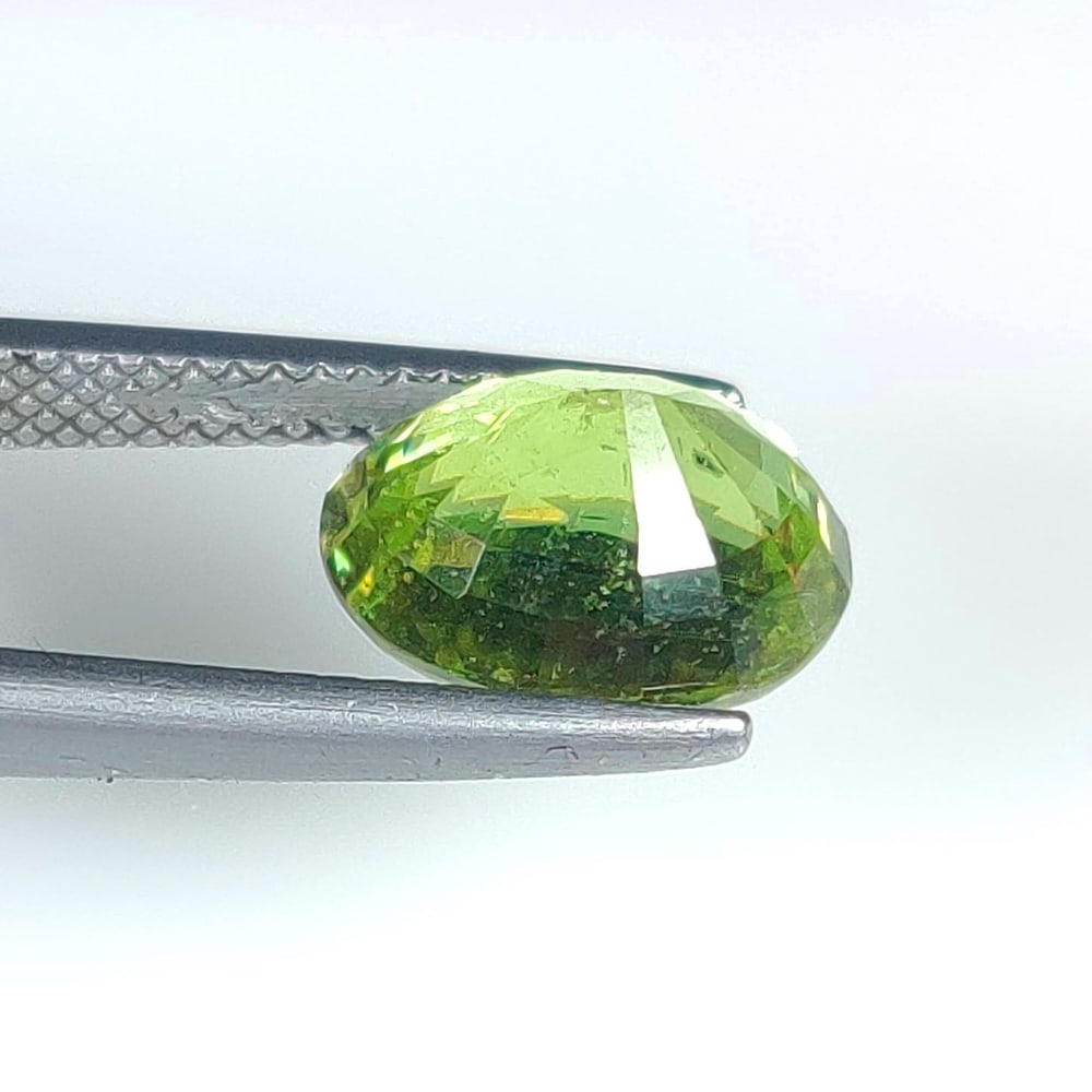 4.21 Ct Natural Green Peridot Oval Cut: Weight - 4.21 Ct / Size - 10.70 x 8.20 x 6.20 mm / Shape - Oval Cut / Color - Green / Clarity - VVS / Origin - Pakistan / Treatment - None