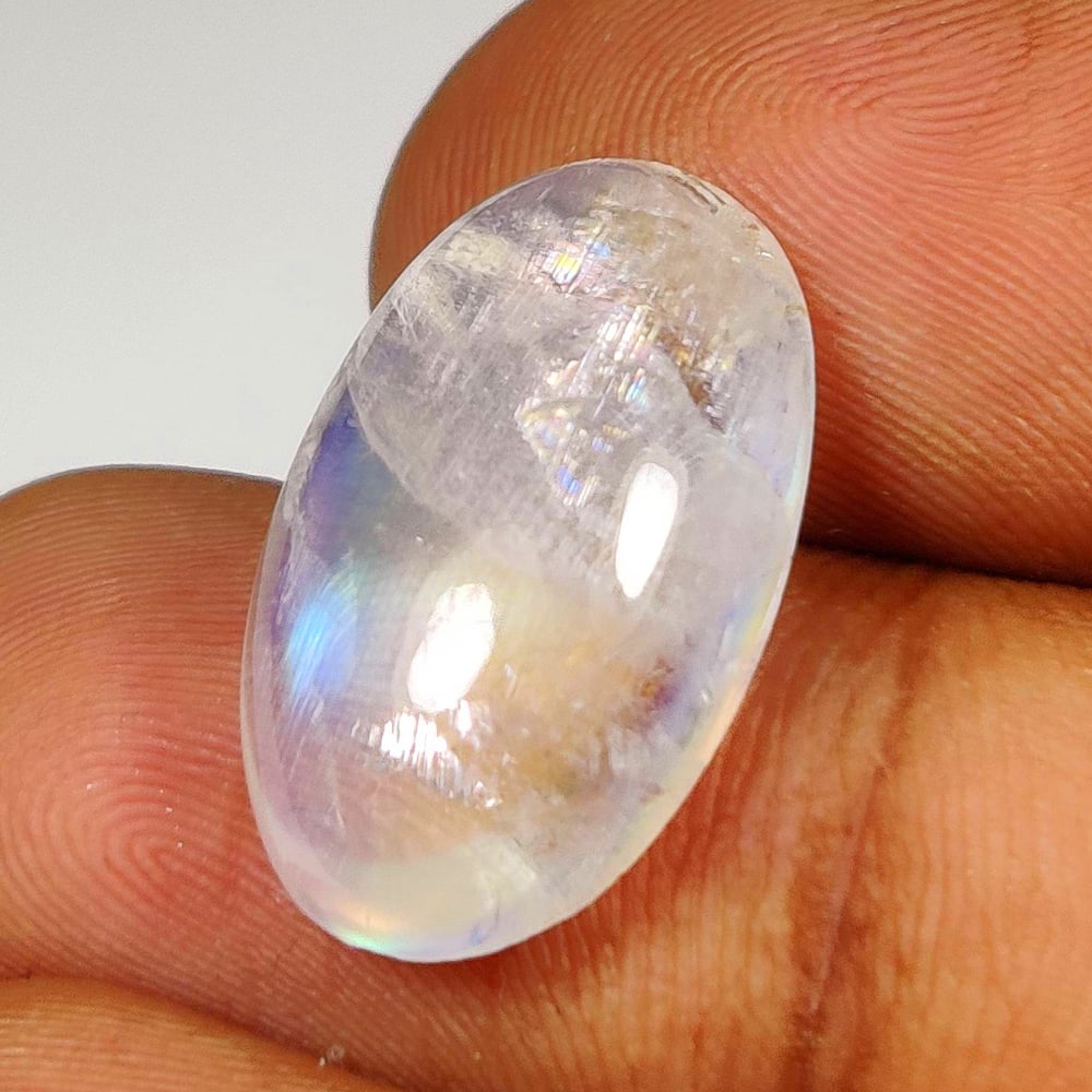 10.33 Ct Natural Blue Tint Moonstone Oval Cab: Weight - 10.33 Ct / Dimensions - 19.10 x 11.60 x 6.30 mm / Shape - Oval Cab / Clarity - Semi-Transparent / Origin - India / Treatment - None