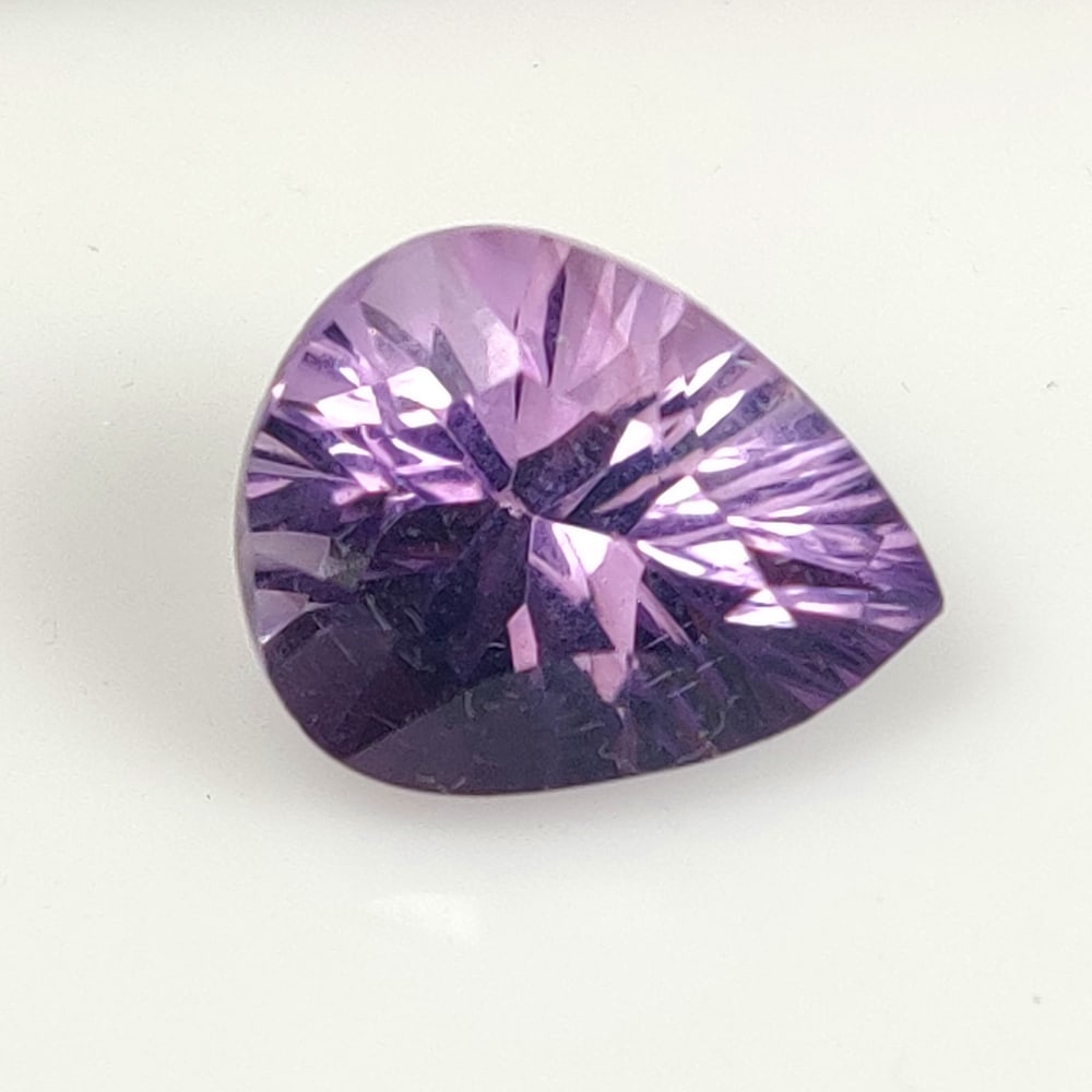 5.67 Ct Natural Purple Amethyst Pear Cut: Weight - 5.67 Ct / Dimensions - 13.20 x 10.50 x 8.30 mm / Shape - Pear Cut / Color - Purple / Clarity - VVS / Origin -Brazil / Treatment - Heated