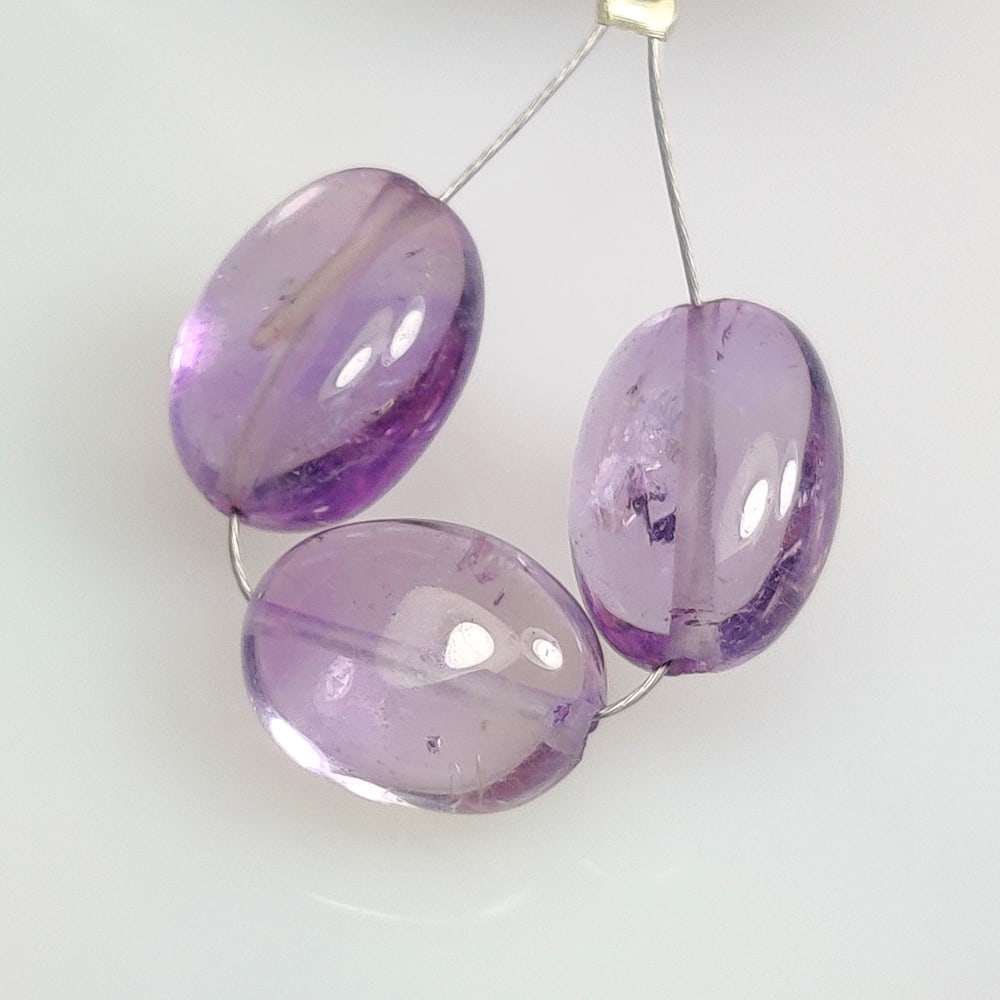 13.49 Ct Natural Purple Amethyst Oval Beads: Weight - 13.49 Ct / Dimensions - 11.0x8.6 - 11.9x8.9 mm / 3 Pc's / Shape - Oval Beads / Color - Purple / Clarity - VVS / Origin -Brazil / Treatment - Heated