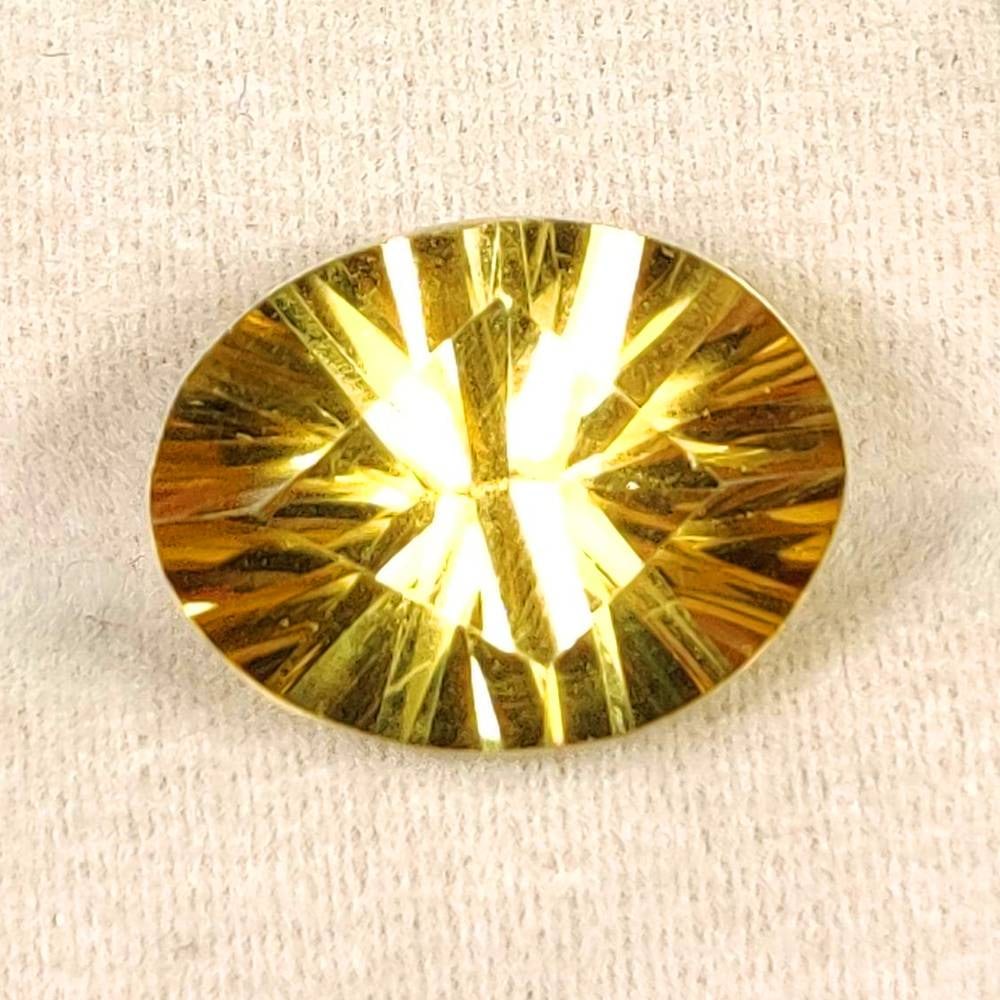7.22 Ct Natural Yellow Citrine Oval Cut: Weight - 7.22 Ct / Dimensions - 15.00 x 12.00 x 8.10 mm / Shape - Oval Cut / Color - Yellow / Clarity - VVS / Origin - Brazil / Treatment - Heated