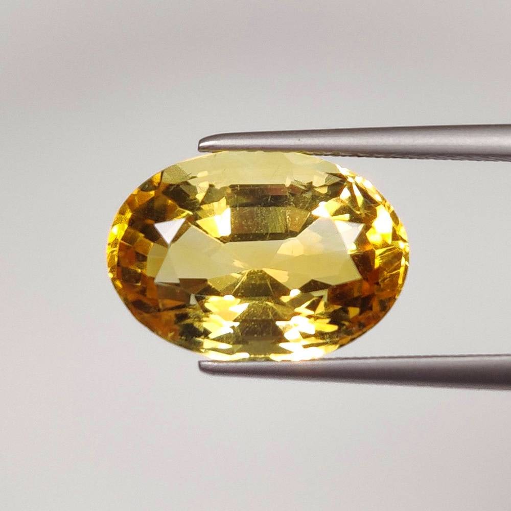 7.15 Ct Natural Yellow Citrine Oval Cut: Weight - 7.15 Ct / Dimensions - 15.00 x 10.60 x 8.30 mm / Shape & Cut - Oval Cut / Color - Yellow / Clarity - VVS / Origin - Brazil / Comments - Heated