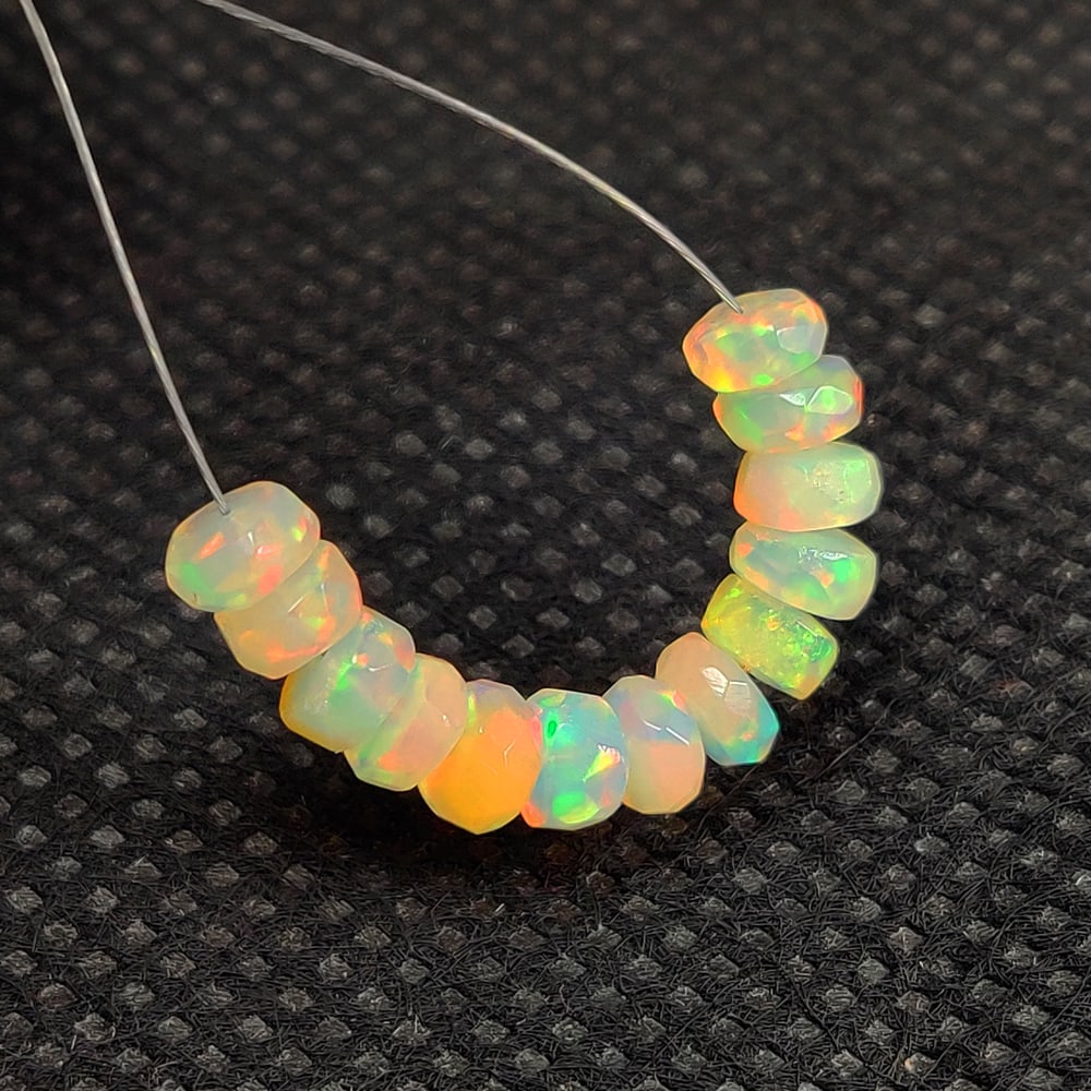 4.06 Ct Natural Multicolor Welo Opal Flash Fire Round Beads: Weight - 4.06 Ct / Dimensions - 4.40 - 4.70 mm / 13 PC's / Shape & Cut - Round Beads / Color - Multicolor / Transparency - Translucent / Origin - Ethiopia / Comments - None