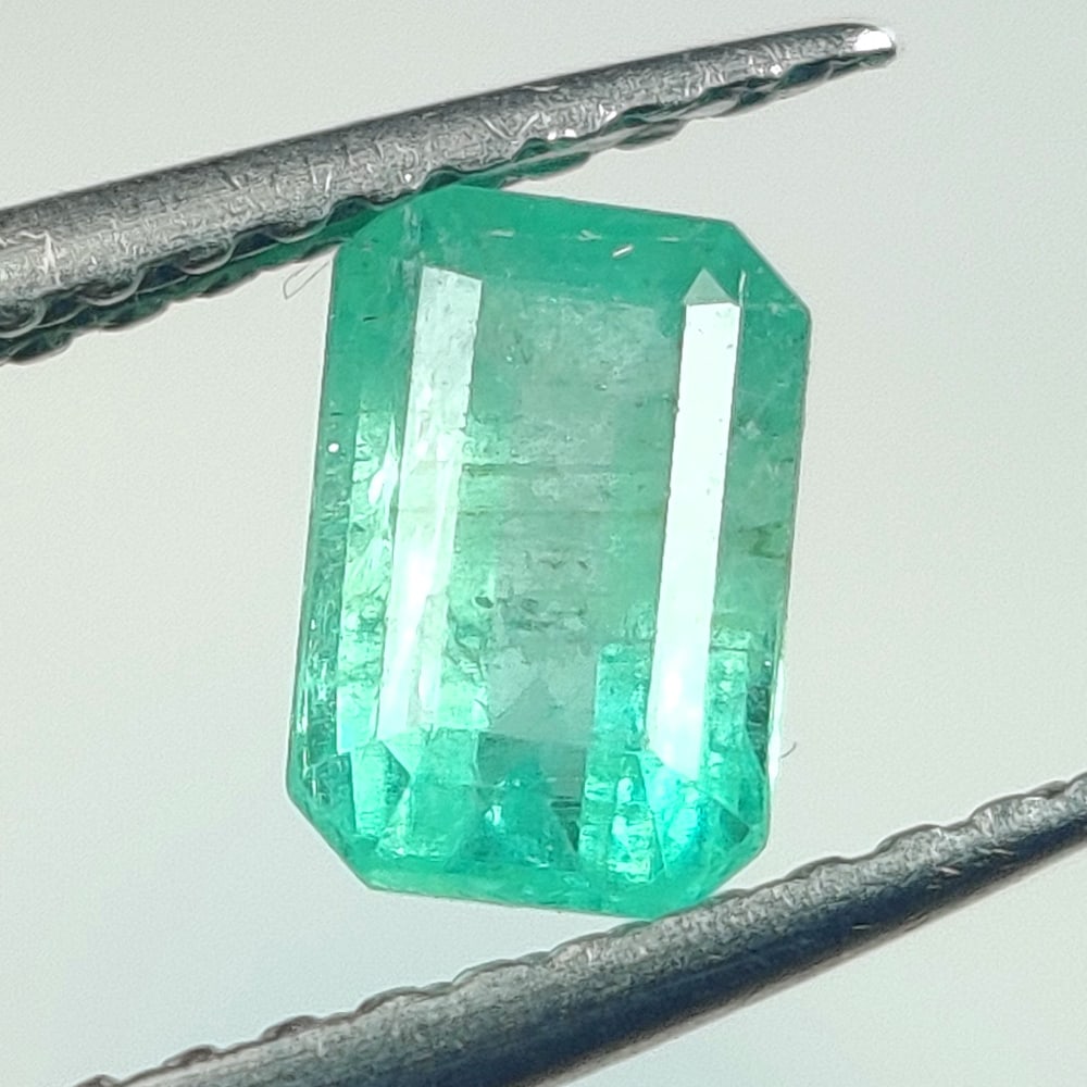 0.67 Ct Natural Zambian Top Green Emerald-Emerald Cut: Weight - 0.67 Ct / Dimensions - 6.20 x 4.10 x 3.40 mm/ Shape - Octagon Cut / Color - Green / Clarity - SI / Origin - Zambia / Treatment - Natural Emeralds are commonly enhanced by oil