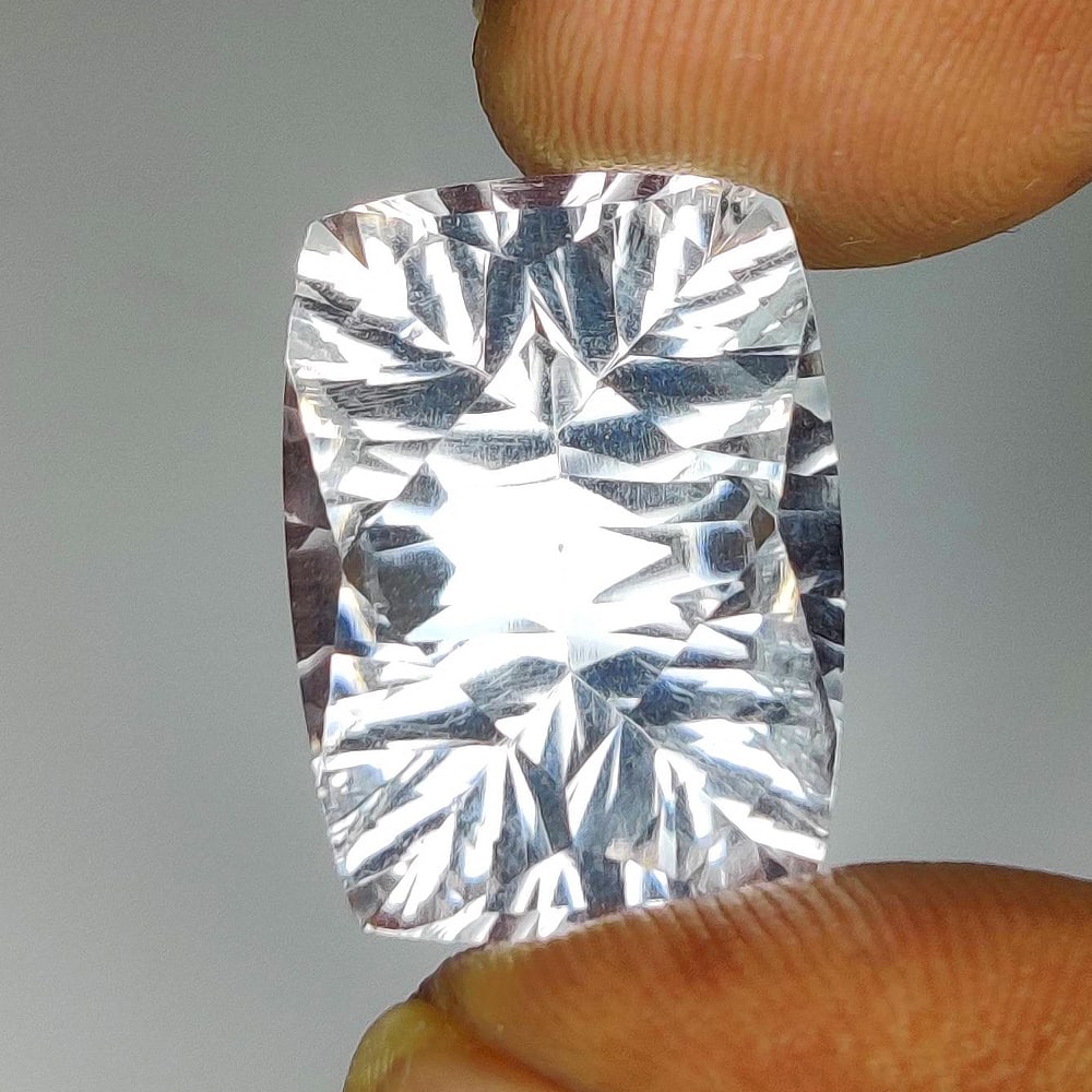 12.59 Ct Natural Colorless Quartz Cushion Cut: Weight - 12.59 Ct / Dimensions - 18.00 x 13.00 x 8.60 mm / Shape & Cut - Cushion Cut / Color - White / Transparency - VVS / Origin - Brazil / Comments - None