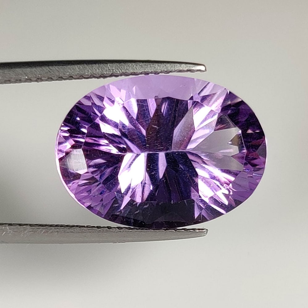 10.85 Ct Natural Purple Amethyst Oval Cut: Weight - 10.85 Ct / Dimensions - 18.00 x 13.00 x 8.80 mm / Shape - Oval Cut / Color - Purple / Clarity - VVS / Origin -Brazil / Treatment - Heated