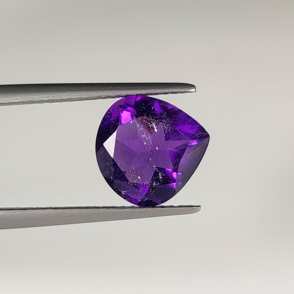 2.98 Ct Natural Purple Amethyst Pear Cut: Weight - 2.98 Ct / Dimensions -10.20 x 10.00 x 5.70 mm / Shape - Pear Cut / Color - Purple / Clarity - VVS / Origin -Brazil / Treatment - Heated
