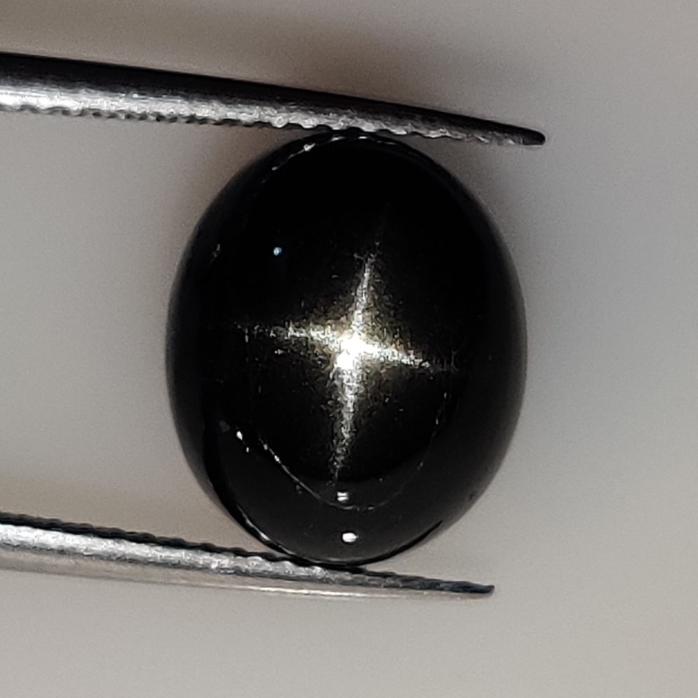 6.61 Ct Natural Star Diopside Oval Cab: Weight - 6.61 Ct / Dimensions - 12.10 x 10.20 x 5.90 mm / Shape - OVal Cab / Color - Black / Clarity - Opaque / Origin - India / Treatment - None