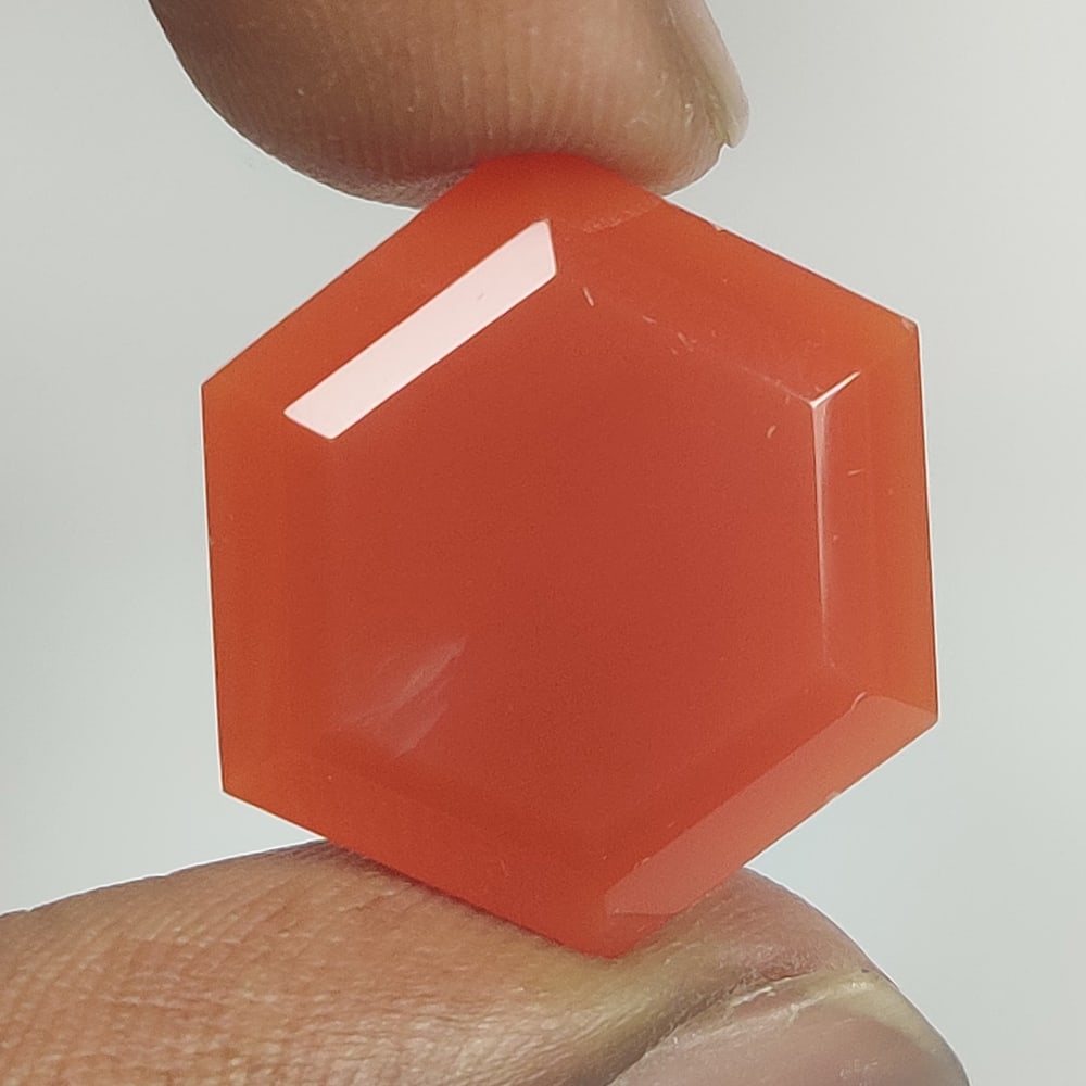 20.00 Ct Natural Red Onyx Hexagon Cut: Weight - 20.00 Ct / Size - 21.70 x 18.70 x 7.70 mm / Shape - Hexagon Cut / Color - Red / Clarity - OPaque / Origin - Brazil / Treatment - None