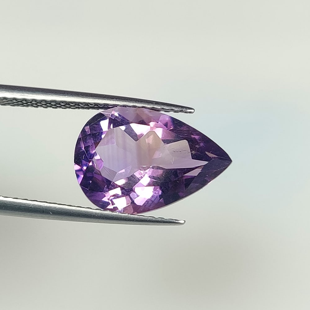 4.62 Ct Natural Purple Amethyst Pear Cut: Weight - 4.62 Ct / Dimensions - 14.10 x 9.90 x 6.60 mm / Shape - Pear Cut / Color - Purple / Clarity - VVS / Origin -Brazil / Treatment - Heated