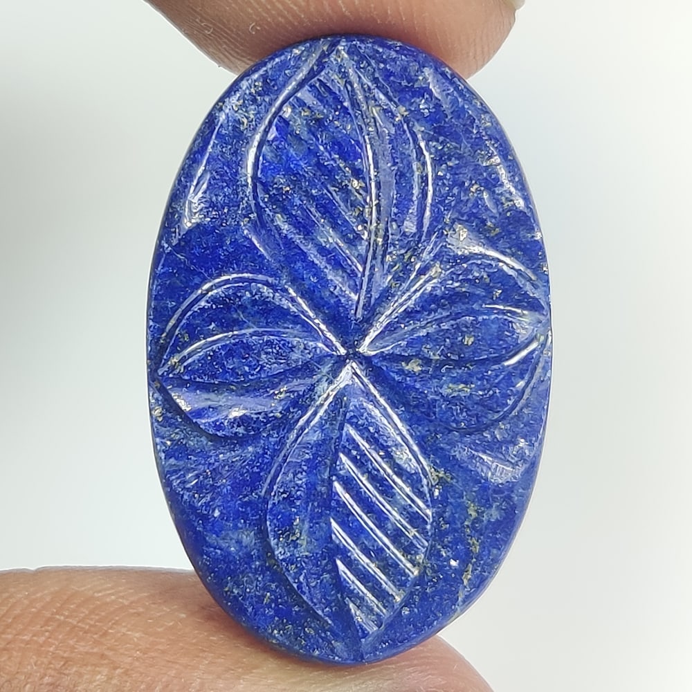 27.19 Ct Natural Blue Lapis Lazuli Oval Cab: Weight - 27.19 Ct / Size - 30.00 x 18.60 x 4.70 mm / Shape - Oval Cab / Clarity - Opaque / Origin - Afghanisthan / Treatment - None